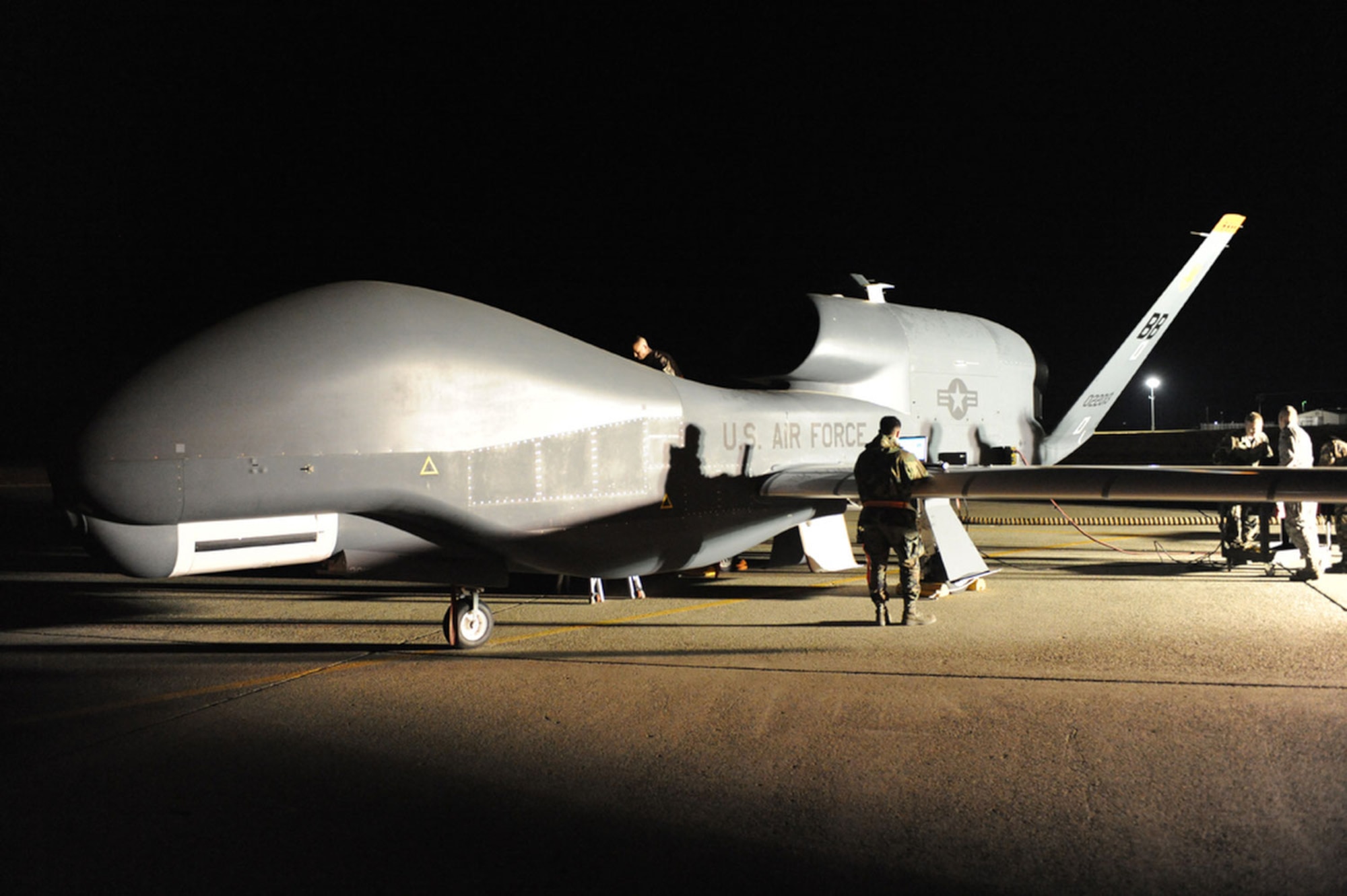 Airmen work on an RQ-4 Global Hawk after it returned to Beale Air Force Base, Calif., as part of a four-ship rotation out of the theater. (U.S. Air Force photo/John Schwab)