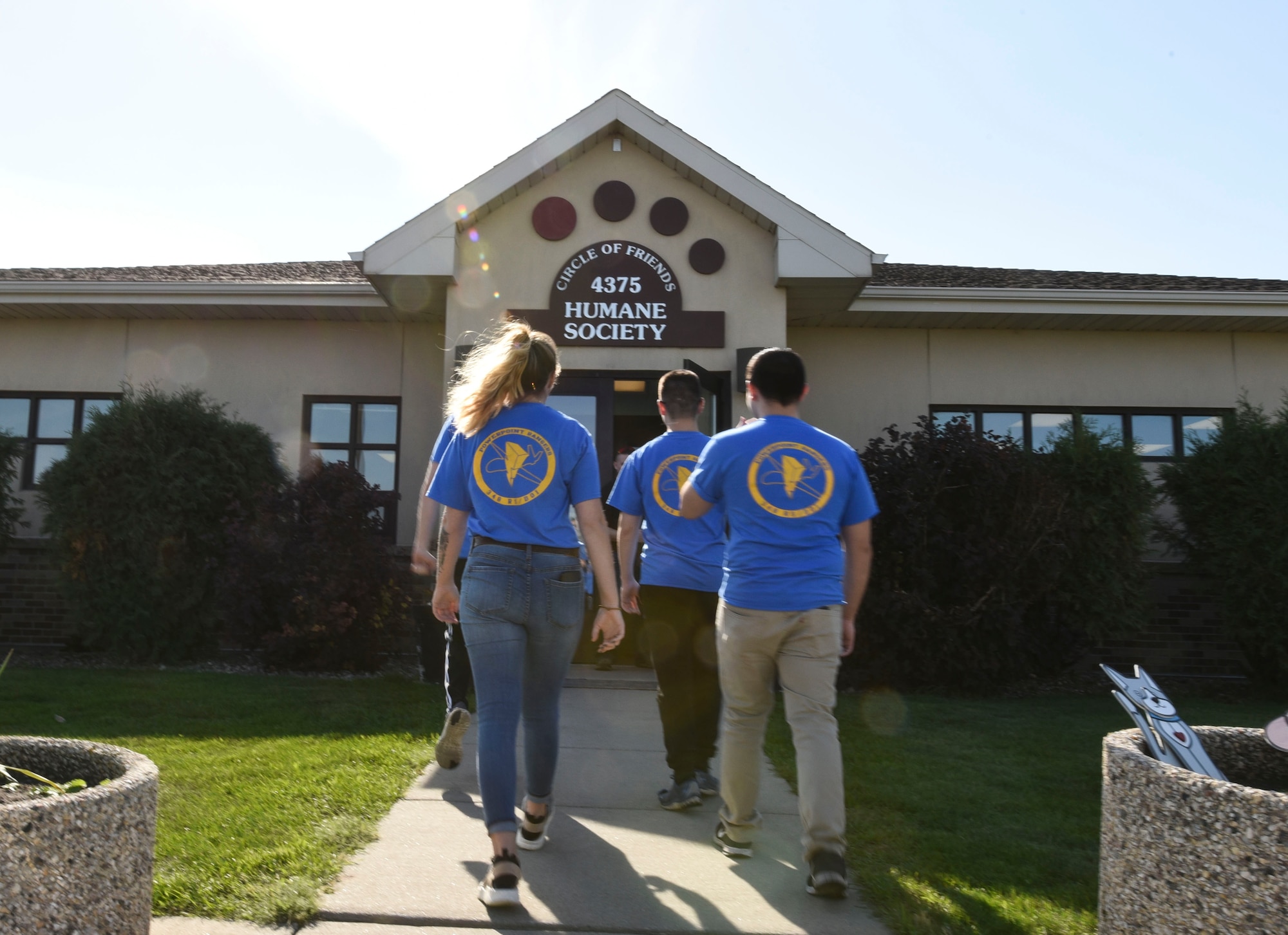 Members from the 348th Reconnaissance Squadron visit Circle of Friends Humane Society to volunteer Sept. 19, 2018, in Grand Forks, North Dakota. The volunteering consisted of tasks being split among the 348 RS members, such as folding towels and cleaning up trash near the animal shelter. (U.S. Air Force photo by Airman 1st Class Melody Wolff)