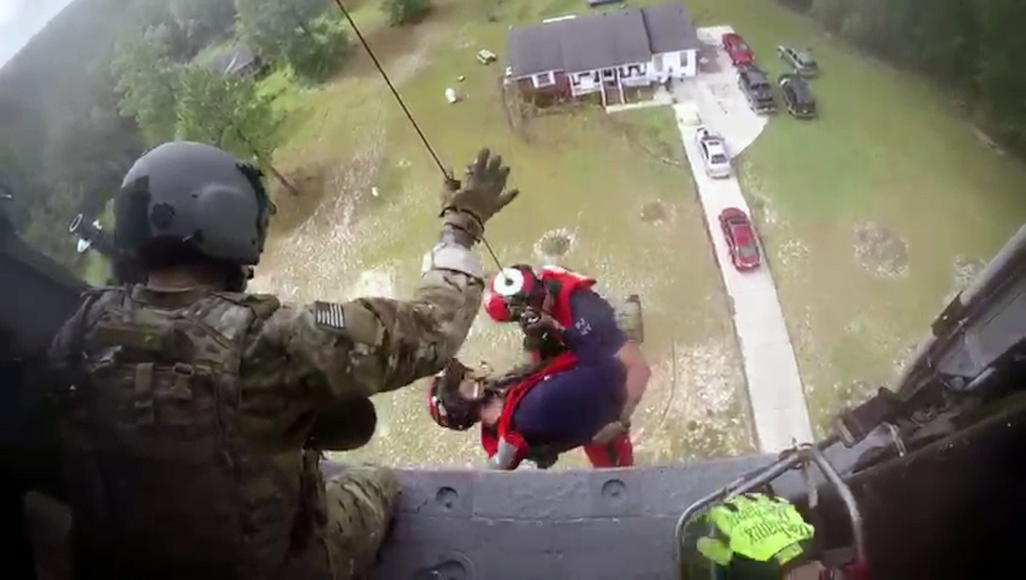 Members of the 106th Rescue Squadron, 106th Rescue Wing, New York Air National Guard, drop from an HH-60 Pavehawk helicopter during a rescue mission during Hurricane Florence,  Sept. 17, 2018.(U.S. Air Force photo by Senior Airman Kyle Hagan)