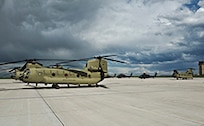 Four Boeing CH-47F Chinook aircrews arrived at the Colorado Army National Guard Aviation Support Facility for the first time with new F-model Chinooks May 17, 2013, at Buckley Air Force Base, Colo. The crews returned to Colorado with the new helicopters after attending a seven-week training course at Hunter Army Airfield, Ga. (U.S. Air Force photo by Airman 1st Class Riley Johnson/Released)
