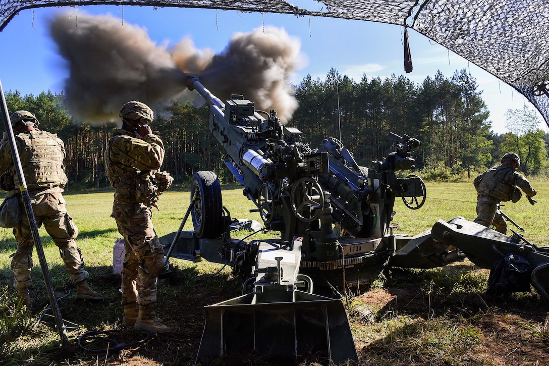 Soldiers fire an M777 howitzer during a live-fire exercise.