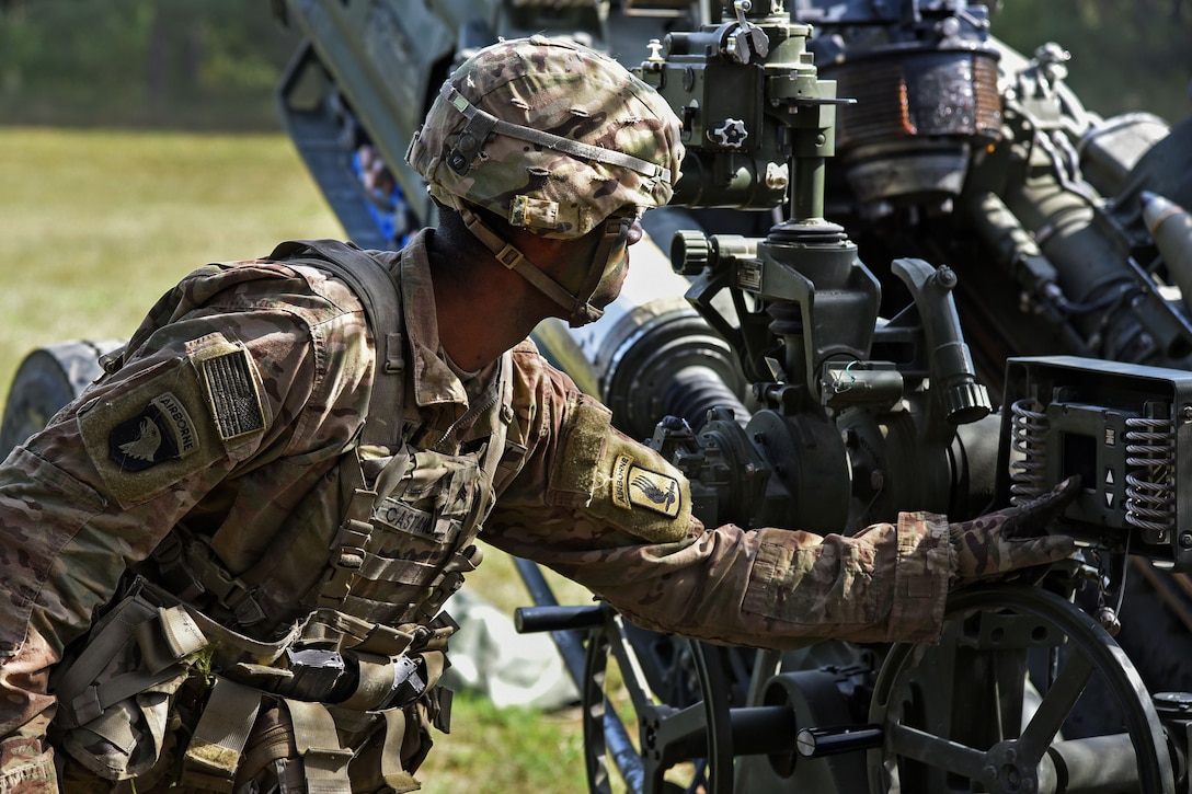 A soldier sets up a M777 howitzer during a live-fire exercise.