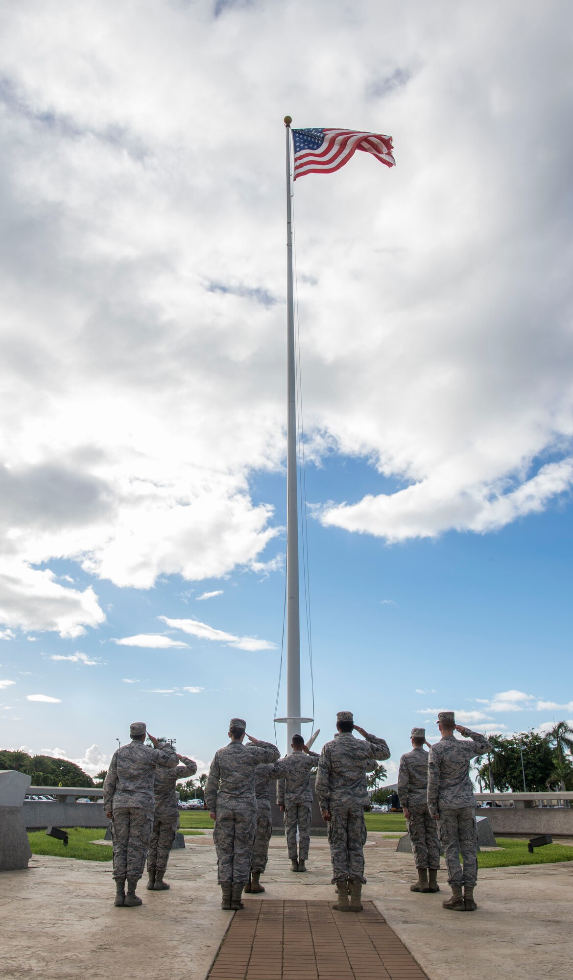 Volunteers from the 15th Wing participate in a Reveille Ceremony for Prisoners of War and Missing in Action Week, Joint Base Pearl Harbor-Hickam, Hawaii, Sept. 17, 2018.  The ceremony was held to honor the sacrifices made by America's prisoners of war, those who are still missing in action and their families. From Sept. 17-21, events will be held throughout JBPHH as part of POW/MIA Recognition Week. The events include readings of the POW/MIA names, a reveille ceremony, beautification of POW/MIA memorial, information tables, sentinel posting, a 24-hour run, and ends on Friday with a POW/MIA Remembrance Ceremony at the National Memorial Cemetery of the Pacific in Honolulu. Observances of National POW/MIA Recognition Day are held across the country on military installations, ships at sea, state capitals, schools and veterans facilities. It is traditionally observed on the third Friday in September each year. (U.S. Air Force photo by Tech. Sgt. Heather Redman)
