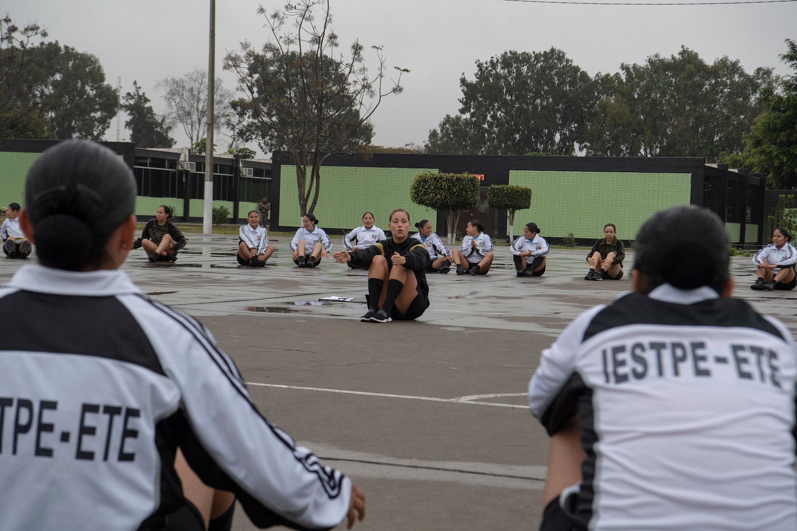 Sgt. Lyndsay Monaco, Not In My Squad (NIMS) workshop facilitator and Brigade S-1 NCO for the National Ground Intelligence Center, conducts physical readiness training with female soldiers of the Peruvian army Sept. 10, 2018, in Lima, Peru. U.S. service members from the WVNG and U.S. Army South worked with the Peruvian Army to facilitate training for non-commissioned officer development, professionalism, ethical behavior, physical fitness, and gender integration for more than 500 PERAR soldiers during a week-long engagement.