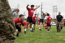 ST. CLOUD, Minn. -- The Marine Corps Officer Selection Team from Fargo, North Dakota, pushes the St. Cloud State University Wrestling team through a Leadership and Cohesion Exercise designed to test their physical and mental strength, as well as their ability to work as team, in St. Cloud, M.N., Sept. 18, 2018. At the end of the exercises, the Marines lead the team through a discussion about their core values; honor, courage and commitment, and how the athletes can apply those values to what they do as wrestlers, but also as students and ambassadors for the university.