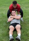 ST. CLOUD, Minn. -- The Marine Corps Officer Selection Team from Fargo, North Dakota, pushes the St. Cloud State University Wrestling team through a Leadership and Cohesion Exercise designed to test their physical and mental strength, as well as their ability to work as team, in St. Cloud, M.N., Sept. 18, 2018. At the end of the exercises, the Marines lead the team through a discussion about their core values; honor, courage and commitment, and how the athletes can apply those values to what they do as wrestlers, but also as students and ambassadors for the university.