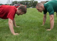 ST. CLOUD, Minn. -- The Marine Corps Officer Selection Team from Fargo, North Dakota, pushes the St. Cloud State University Wrestling team through a Leadership and Cohesion Exercise designed to test their physical and mental strength, as well as their ability to work as team, in St. Cloud, M.N., Sept. 18, 2018. At the end of the exercises, the Marines lead the team through a discussion about their core values; honor, courage and commitment, and how the athletes can apply those values to what they do as wrestlers, but also as students and ambassadors for the university.