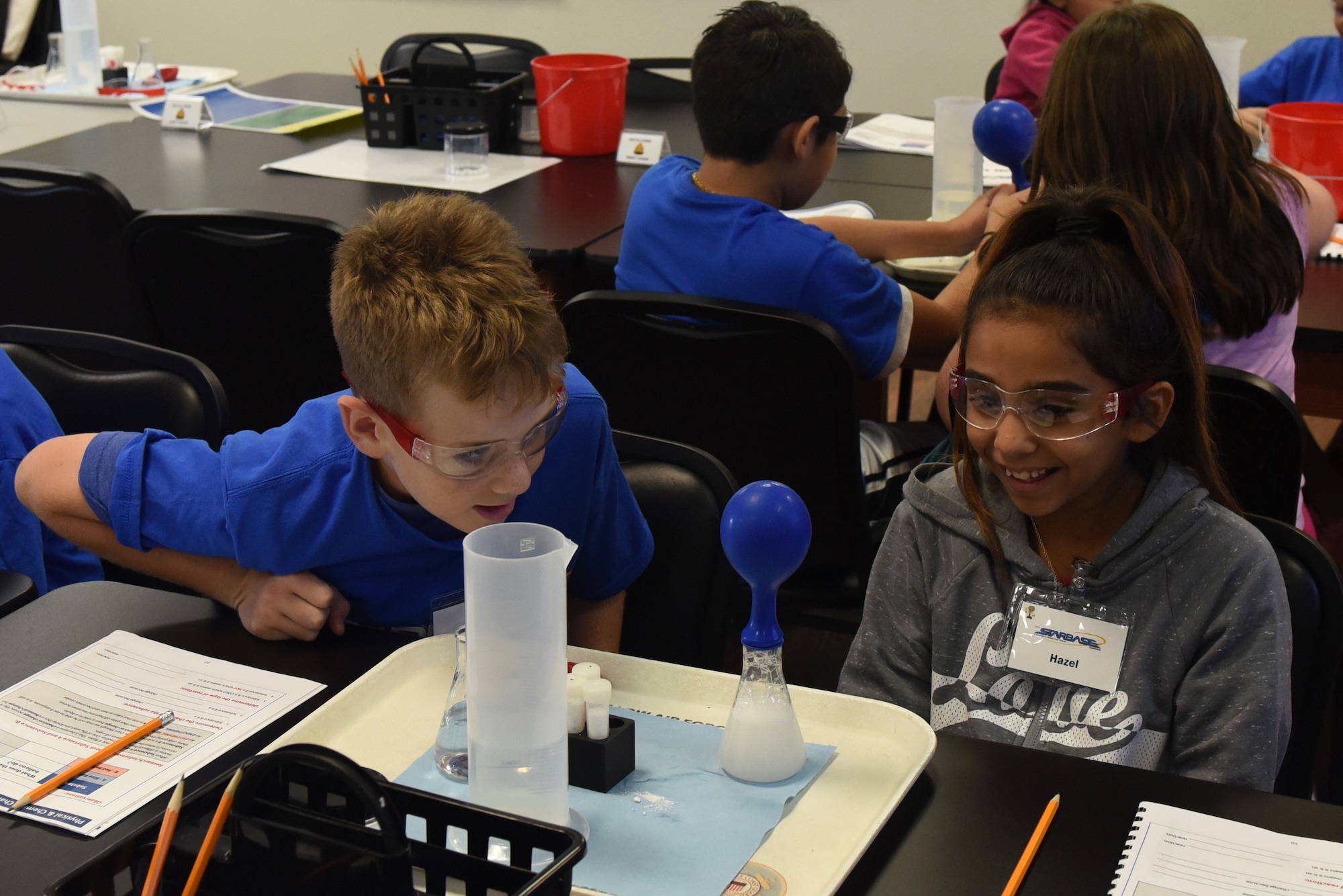 Fifth graders learn about chemical reactions and gasses by observing changes in a balloon during their time at STARBASE at Goodfellow Air Force Base, Texas, Sept. 7, 2018. While attending STARBASE, the students learned about, science, technology, engineering and mathematic principles and applied them through experiments. (U.S. Air Force photo by Airman 1st Class Zachary Chapman/Released)