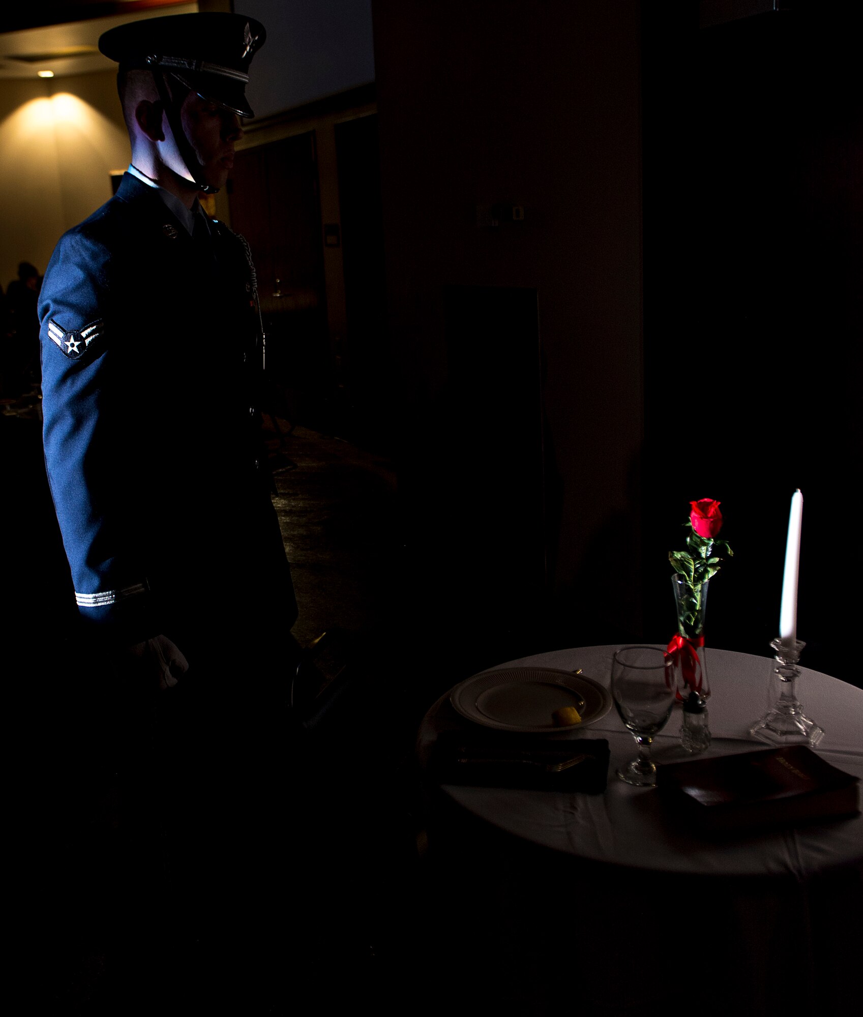 Airman 1st Class Daulton Snyder, Honor Guard member assigned to the 97th Air Mobility Wing, performs a ceremony to honor prisoners of war and missing in action service members during the Annual Awards Ceremony Feb. 2, 2018, at Altus Air Force Base, Okla. Honor Guard members perform in ceremonies in order to honor both Air Force heritage and fallen service members.