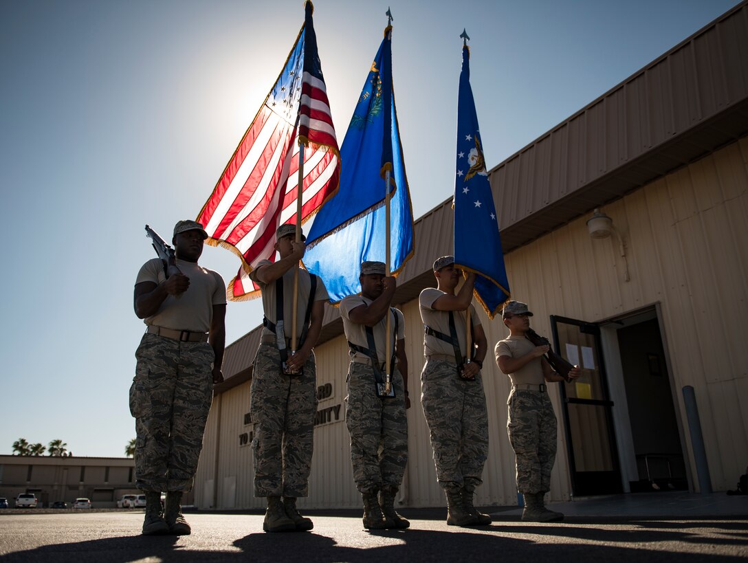 Nellis Air Force Base honor guardsmen practice presenting the colors at Nellis AFB, Nevada, Sept. 12, 2018. The Honor Guard is responsible for rendering military honors for funeral services and various Air Force ceremonies. (U.S. Air Force photo by Airman 1st Class Andrew D. Sarver)