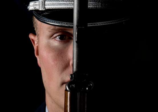 Senior Airman Jacob Green, Nellis Air Force Base honor guardsman, holds his rifle in front of him at Nellis AFB, Nevada, Sept. 13, 2018. It takes nearly a month for a guardsman to learn just the basic ceremonial maneuvers. (U.S. Air Force photo by Airman 1st Class Andrew D. Sarver)