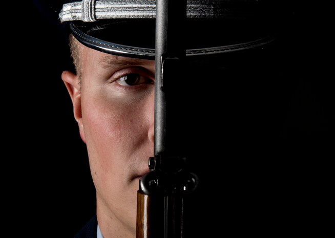 Senior Airman Jacob Green, Nellis Air Force Base honor guardsman, holds his rifle in front of him at Nellis AFB, Nevada, Sept. 13, 2018. It takes nearly a month for a guardsman to learn just the basic ceremonial maneuvers. (U.S. Air Force photo by Airman 1st Class Andrew D. Sarver)