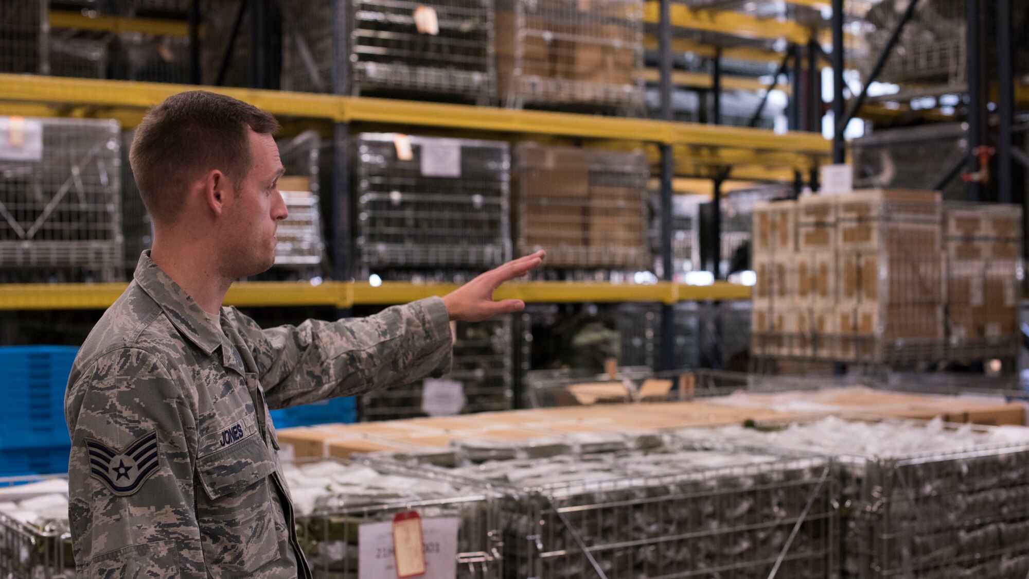 U.S. Air Force Staff Sgt. Jeffery Jones, 92nd Logistics Readiness Squadron Individual Protective Equipment supervisor, checks the lot number on a Joint First Aid Kit package Sept. 19, 2018, at Fairchild Air Force Base, Washington. IPE is a sub-unit of the Materials Management Flight, which works within the LRS. (U.S. Air Force photo/Senior Airman Ryan Lackey)