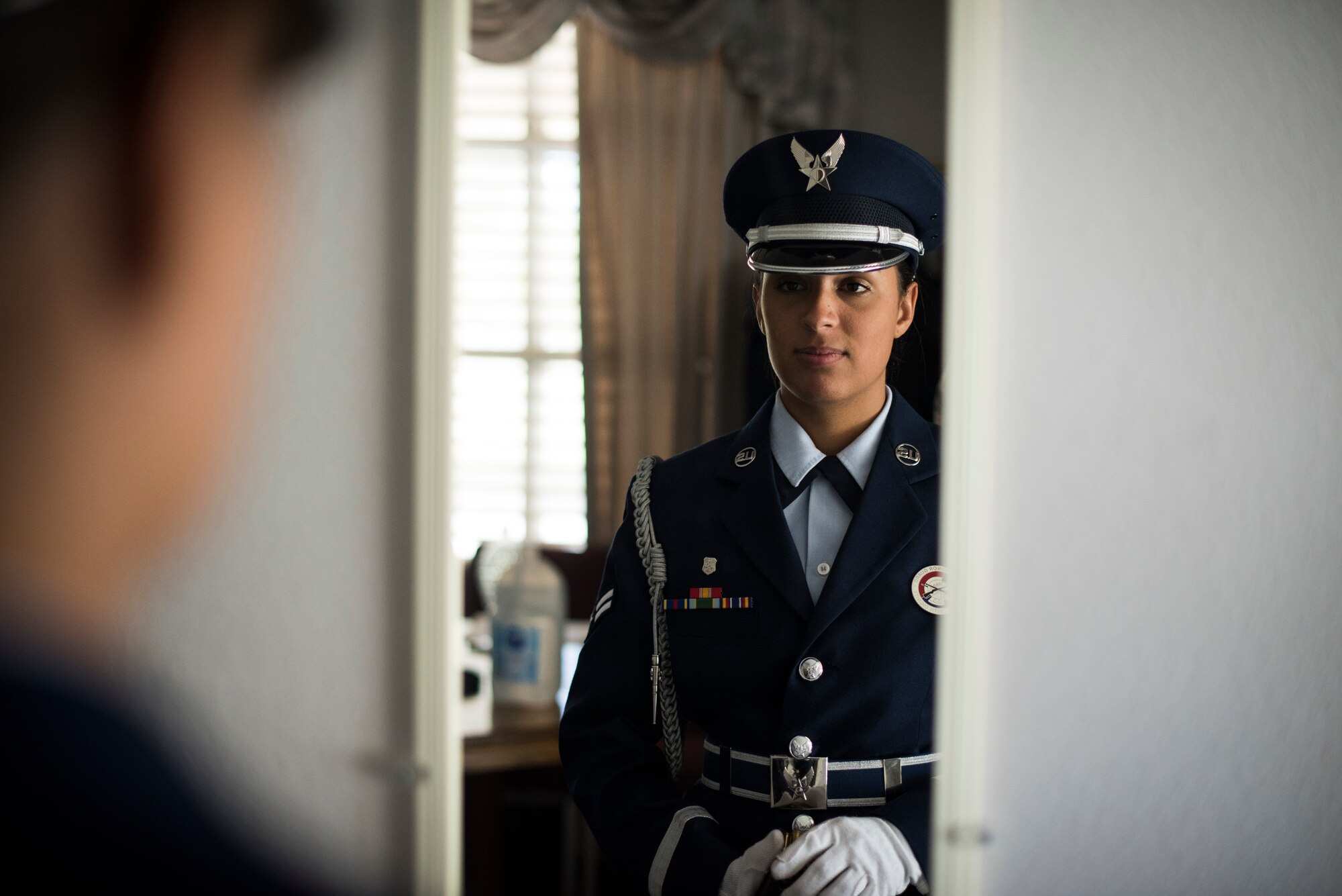 A1C Ashley Libbey, Nellis Air Force Base honor guardsman, performs a last-minute uniform inspection at the Southern Nevada Veterans Memorial Cemetery, Sept. 14, 2018. The mission of the Nellis Honor Guard is to represent the Air Force in a variety of ceremonial functions in Southern Nevada, California, Arizona and Utah. (U.S. Air Force photo by Airman 1st Class Andrew D. Sarver)