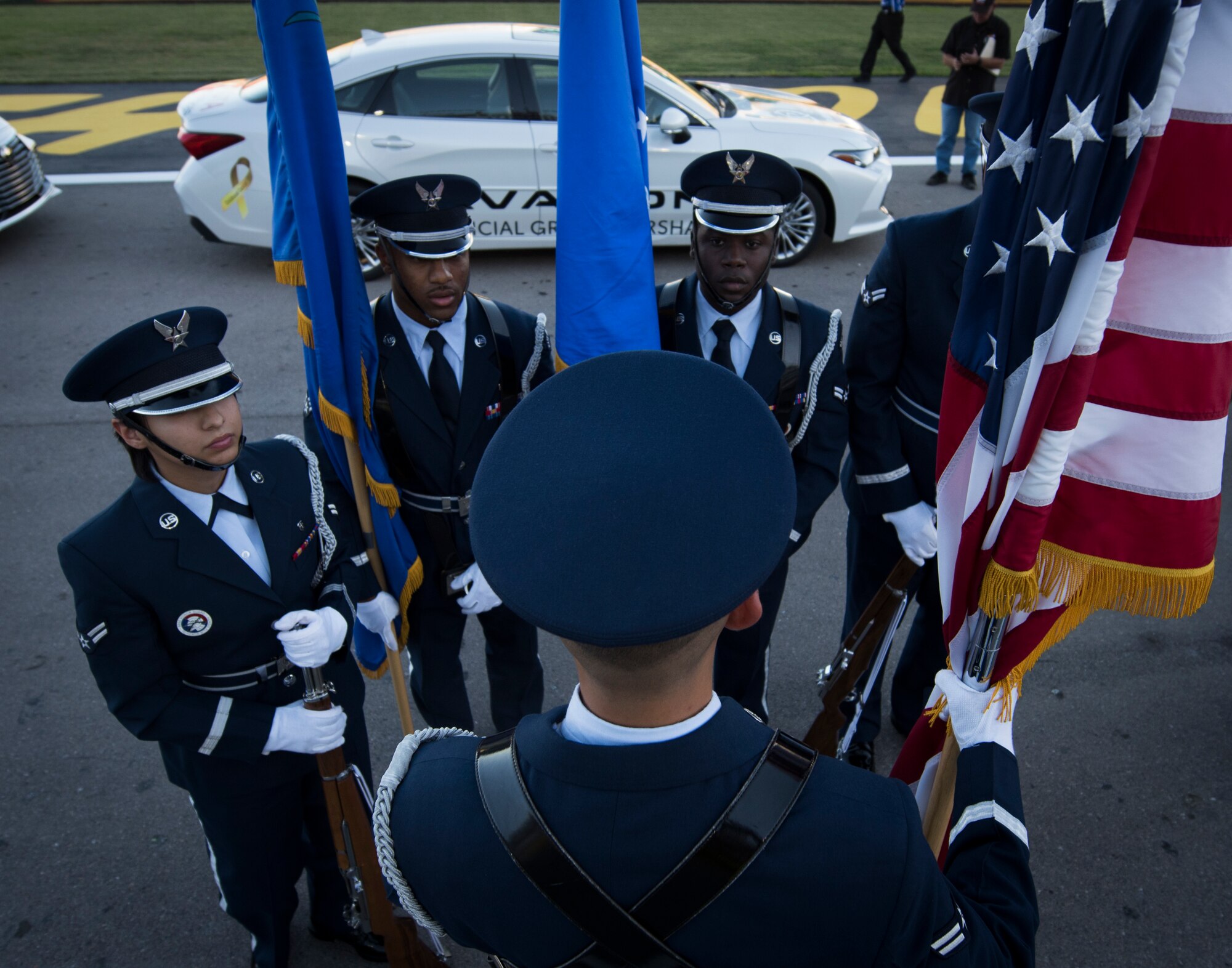 Nellis Honor Guardsmen perform final checks before presenting the colors at the South Point 400 NASCAR race opening ceremonies at the Las Vegas Motor Speedway, Sept. 14, 2018. Presenting the colors requires a team of five ceremonial guardsmen. (U.S. Air Force photo by Airman 1st Class Andrew D. Sarver)