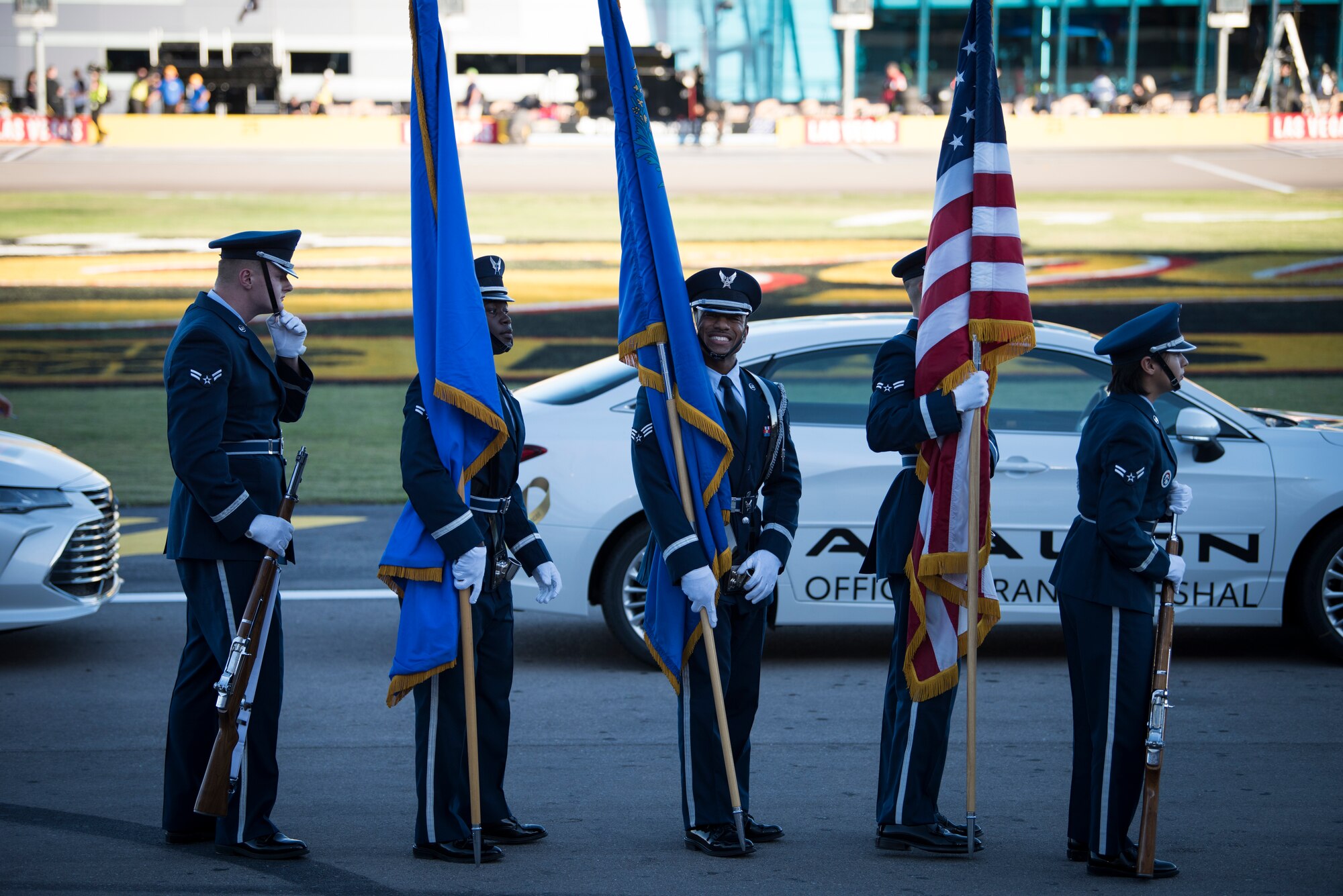Senior Airman Clifford Hugley, Nellis Air Force Base honor guardsman, smiles before the South Point 400 NASCAR race opening ceremonies at the Las Vegas Motor Speedway, Sept. 14, 2018. The mission of the Nellis Honor Guard is to represent the Air Force in a variety of ceremonial functions in Southern Nevada, California, Arizona and Utah. (U.S. Air Force photo by Airman 1st Class Andrew D. Sarver)