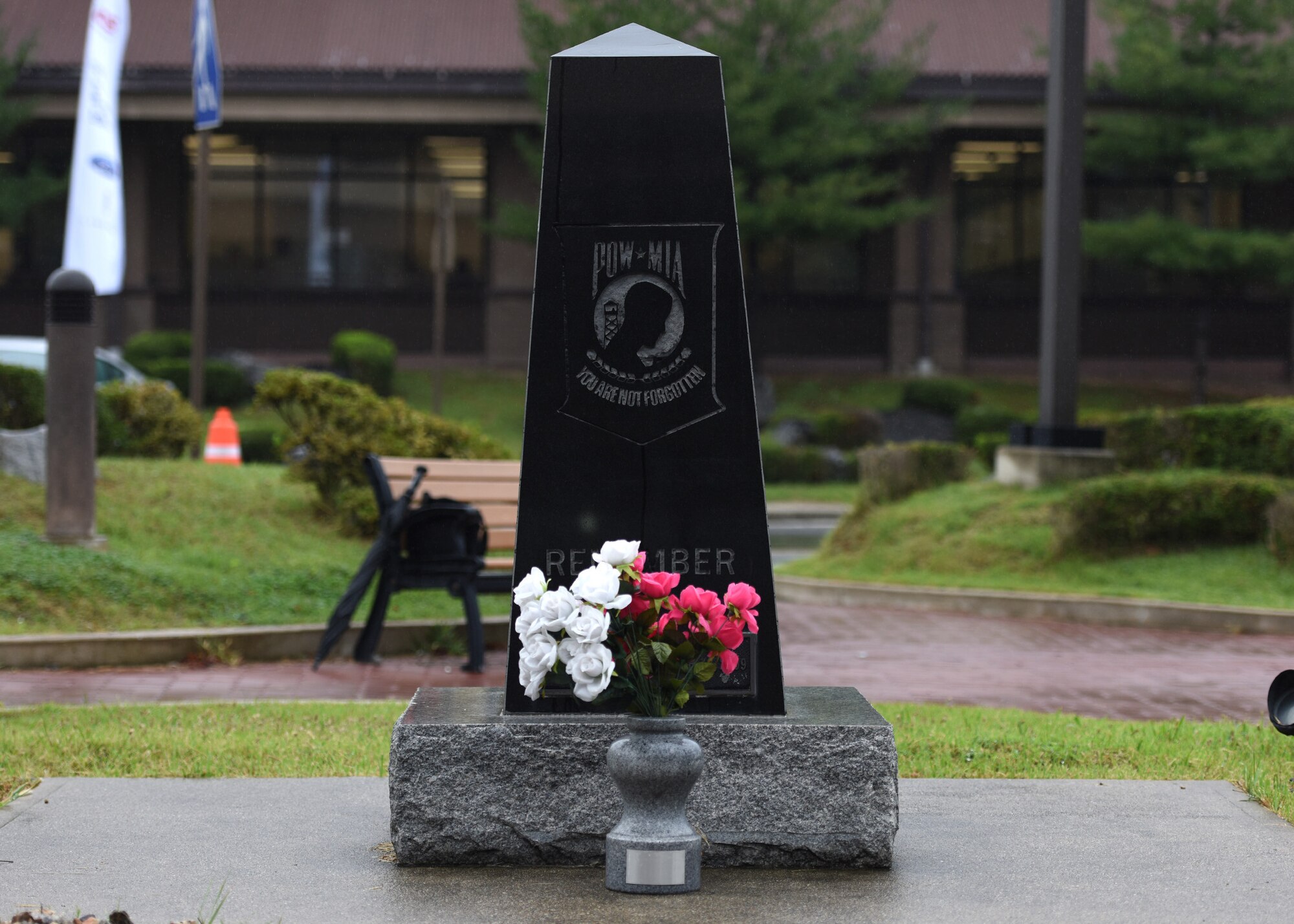A prisoner of war and missing in action memorial sits outside the base theater at Osan Air Base, Republic of Korea, Sept. 20, 2018. According to the Defense POW/MIA Accounting Agency, more than 82,000 Americans remain missing from WWII, the Korean War, Vietnam War, Cold War, Gulf Wars and other recent conflicts. (U.S. Air Force photo by Staff Sgt. Sergio A. Gamboa)