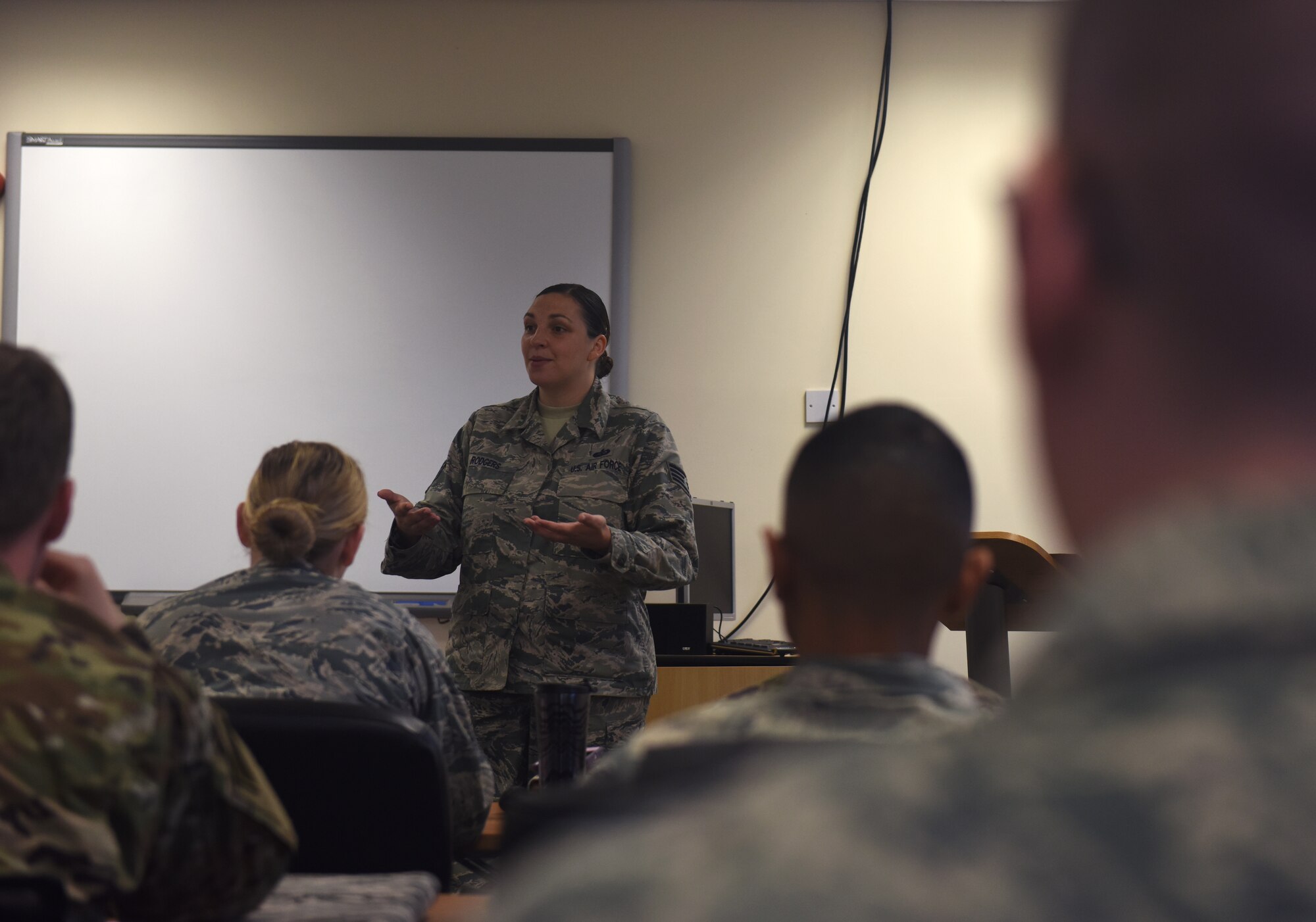 U.S. Air Force Staff Sgt. Megan Rodgers, Team Mildenhall First Term Airmen Center NCO-in-charge, speaks to Airmen during a class at RAF Mildenhall, England, Sept. 11, 2018. Rodgers has been in the Air Force since 2009 and has held the position of FTAC NCOIC since June 2018. (U.S. Air Force photo by Airman 1st Class Brandon Esau)