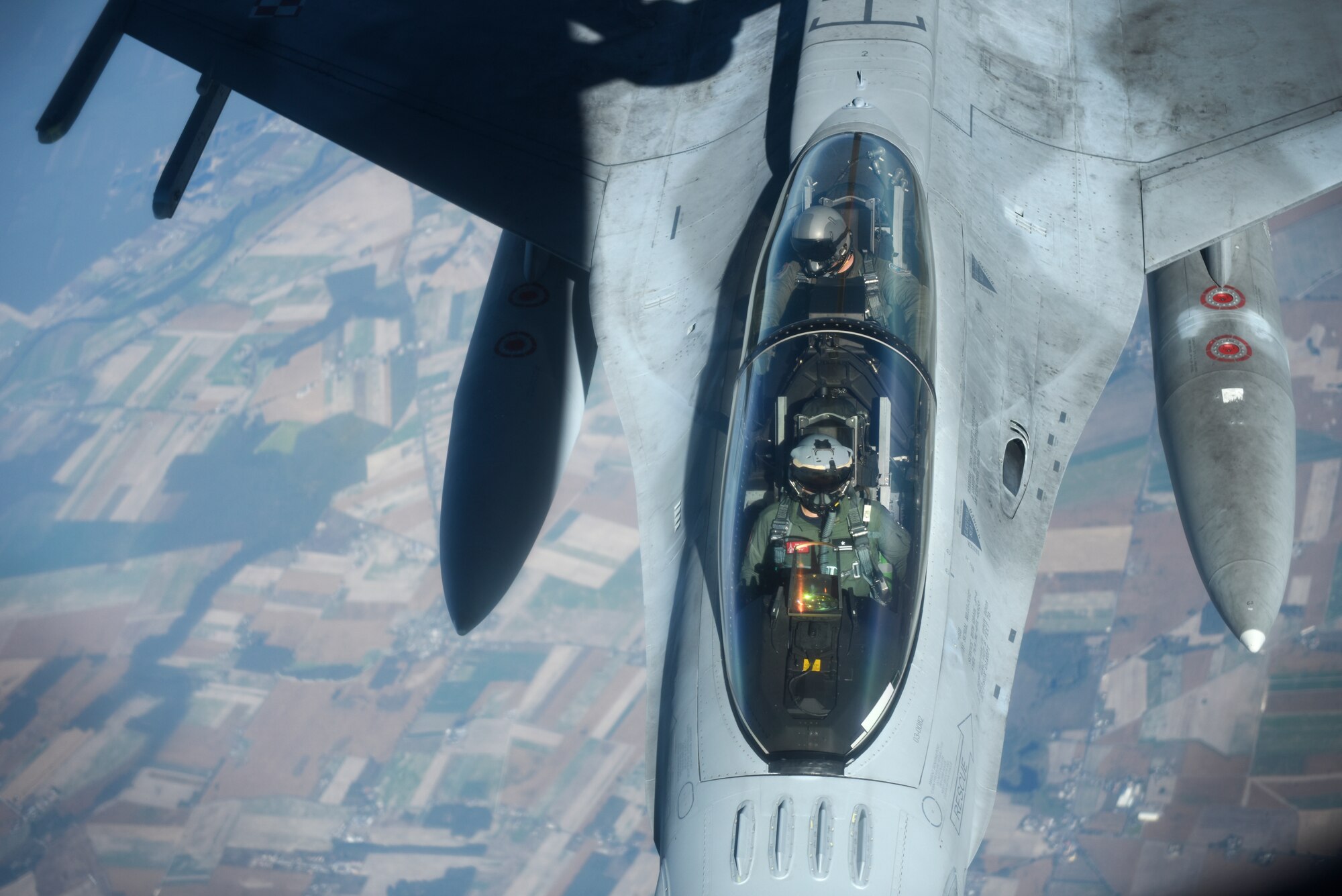 A Polish air force F-16 Fighting Falcon prepares to receive fuel from a U.S. Air Force KC-135 Stratotanker from the 100th Air Refueling Wing, RAF Mildenhall, England in support of exercise One Sky, over Poland, Sept. 20, 2018. The One Sky exercise is an example of U.S. and NATO allies sharing a commitment to promote peace and stability through developing their relationship and communication process. (U.S. Air Force photo by Airman 1st Class Brandon Esau)