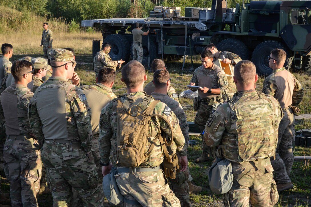 Soldiers receive a mission brief before conducting air assault training.