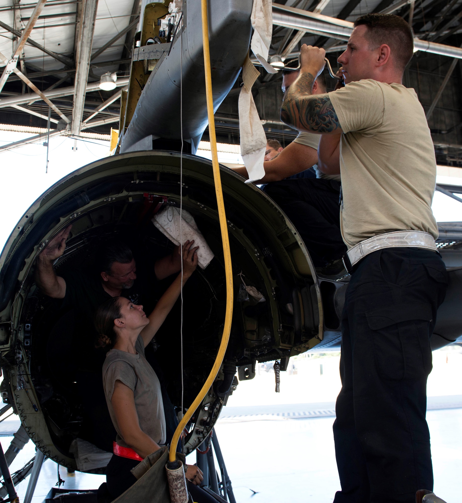 Members of the 20th Aircraft Maintenance Squadron loosen bolts on an F-16 Fighting Falcon at Shaw Air Force Base, S.C., Sept. 6, 2018.