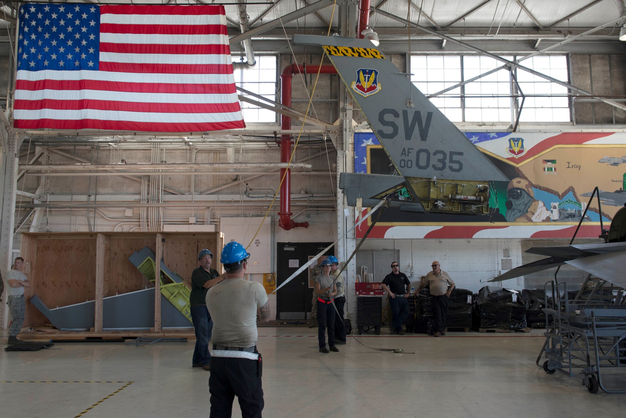 Members of the 20th Aircraft Maintenance Squadron move the vertical stabilizer of an F-16 Fighting Falcon at Shaw Air Force Base, S.C., Sept. 11, 2018.