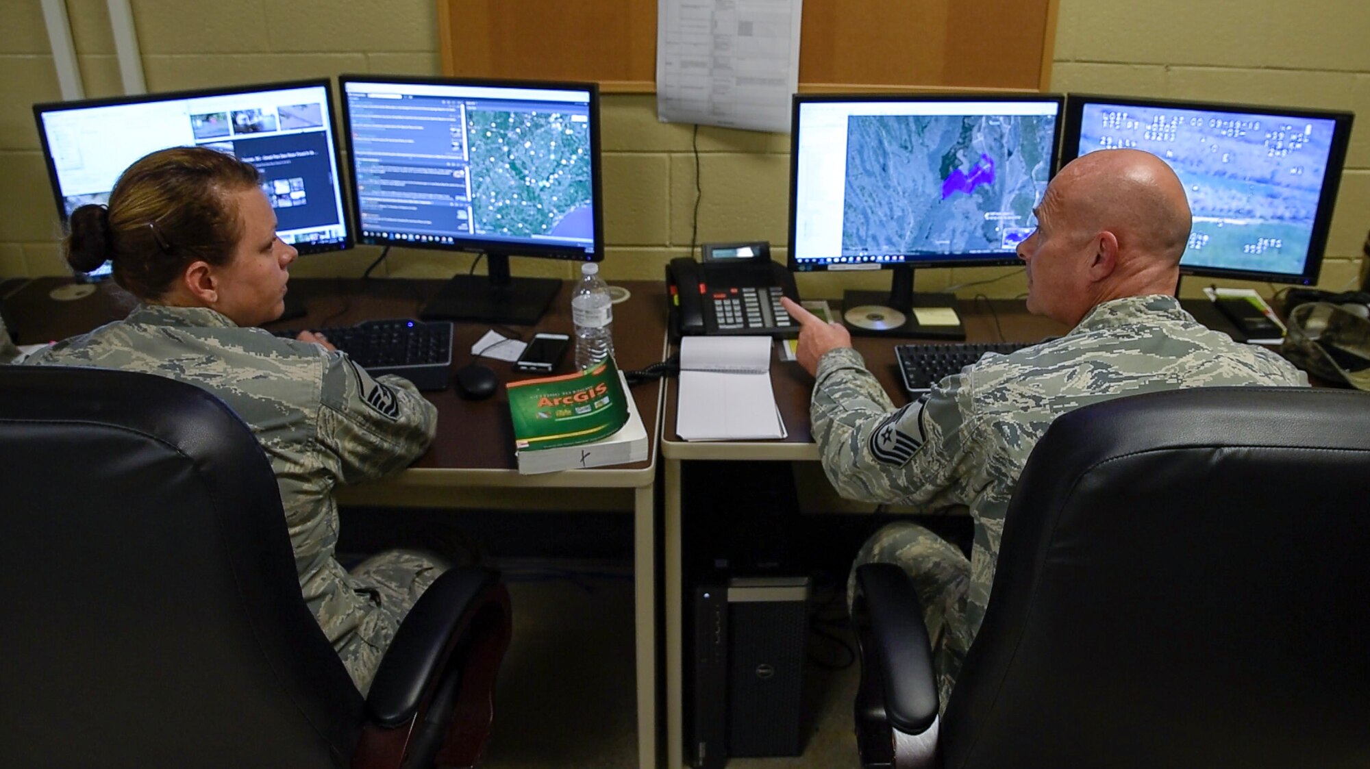 Master Sgts. Twila Costiloe and Jeffery Ames, 188th UPAD analysts, prepare information products in the 188th Unclassified Processing, Assessment, and Dissemination (UPAD) element at Ebbing Air National Guard Base, Ark., to support Hurricane Florence response efforts Sept. 20, 2018.  The UPAD provides graphical information products to incident commanders in affected areas in order to effectively coordinate response efforts.  (U.S. Air National Guard photo by Staff Sgt. Matthew Matlock)