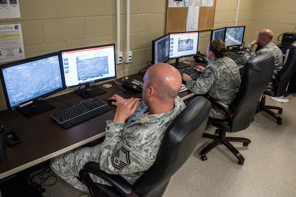 Intelligence Analysts gather infortion in the 188th Unclassified Processing, Assessment, and Dissemination (UPAD) element at Ebbing Air National Guard Base, Ark., to support Hurricane Florence response efforts Sept. 20, 2018.  The UPAD provides graphical information products to incident commanders in affected areas in order to effectively coordinate response efforts.  (U.S. Air National Guard photo by Staff Sgt. Matthew Matlock)