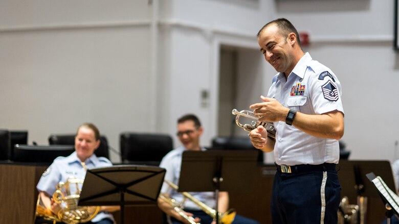 A member of the Gateway Brass, the brass ensemble of the United States Air Force Band of the West, speaks to Bossier Parish students during a Bossier Instructional Center music workshop in Bossier City, La., Sept. 20, 2018. The ensemble is a component of the USAF Band of the West located at Joint Base San Antonio-Lackland, Texas where Air Education & Training Command conducts Basic Military Training for over 30,000 young men and women every year.