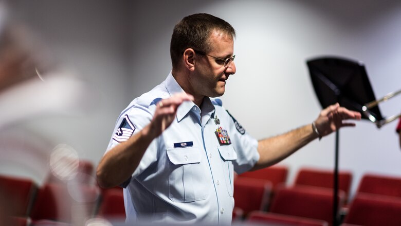 A member of the Gateway Brass, the brass ensemble of the United States Air Force Band of the West, conducts Bossier Parish students during a Bossier Instructional Center music workshop in Bossier City, La., Sept. 20, 2018. The group of active duty Airman musicians performs arange of musical styles spanning five centuries