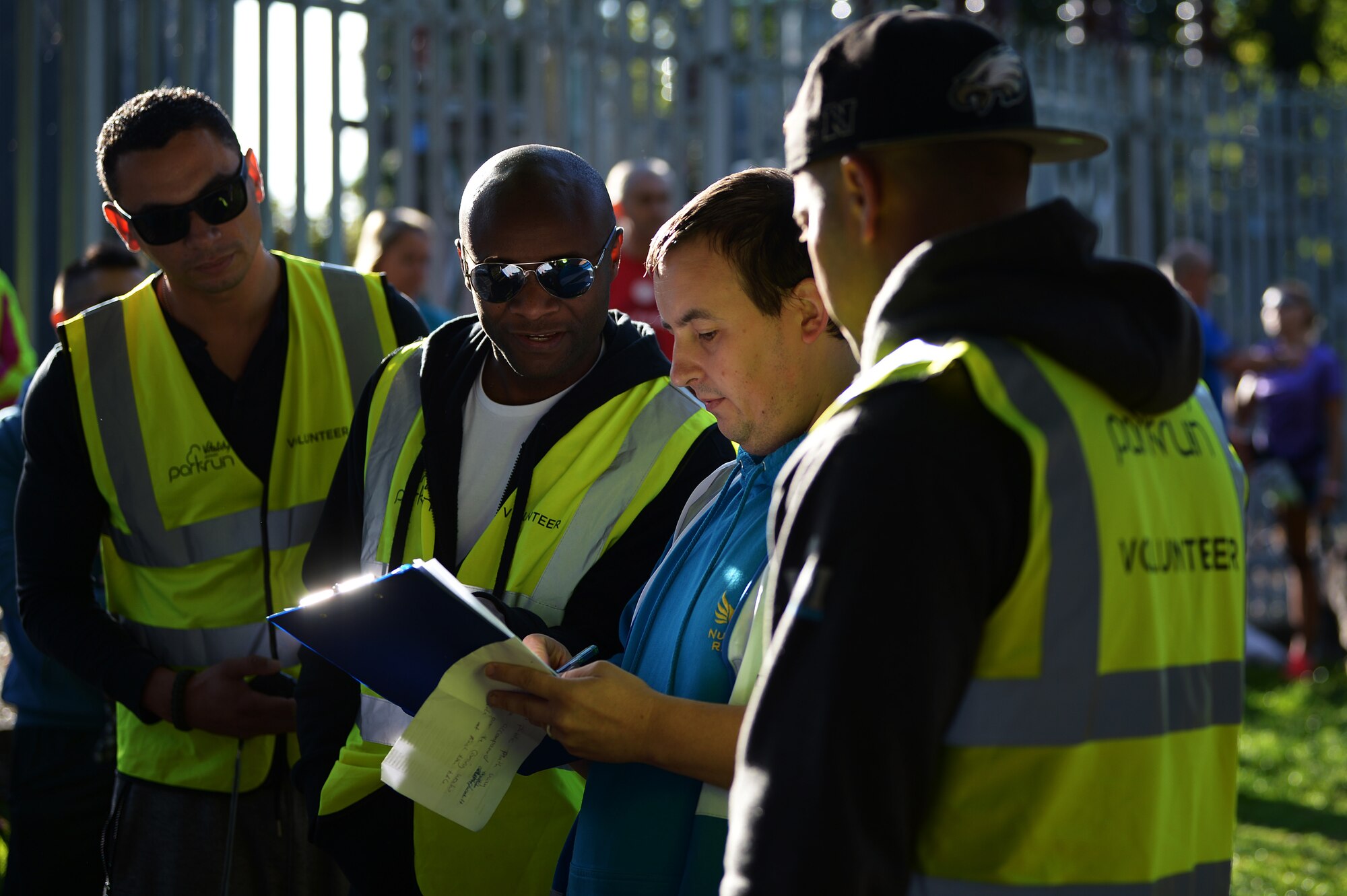 Liberty Wing Airmen receive their assigned positions from a Thetford Parkrun director in Thetford, England, Sept. 15, 2018. The weekly runs are free and open to the local community.  (U.S. Air Force photo/Airman 1st Class Shanice Williams-Jones)