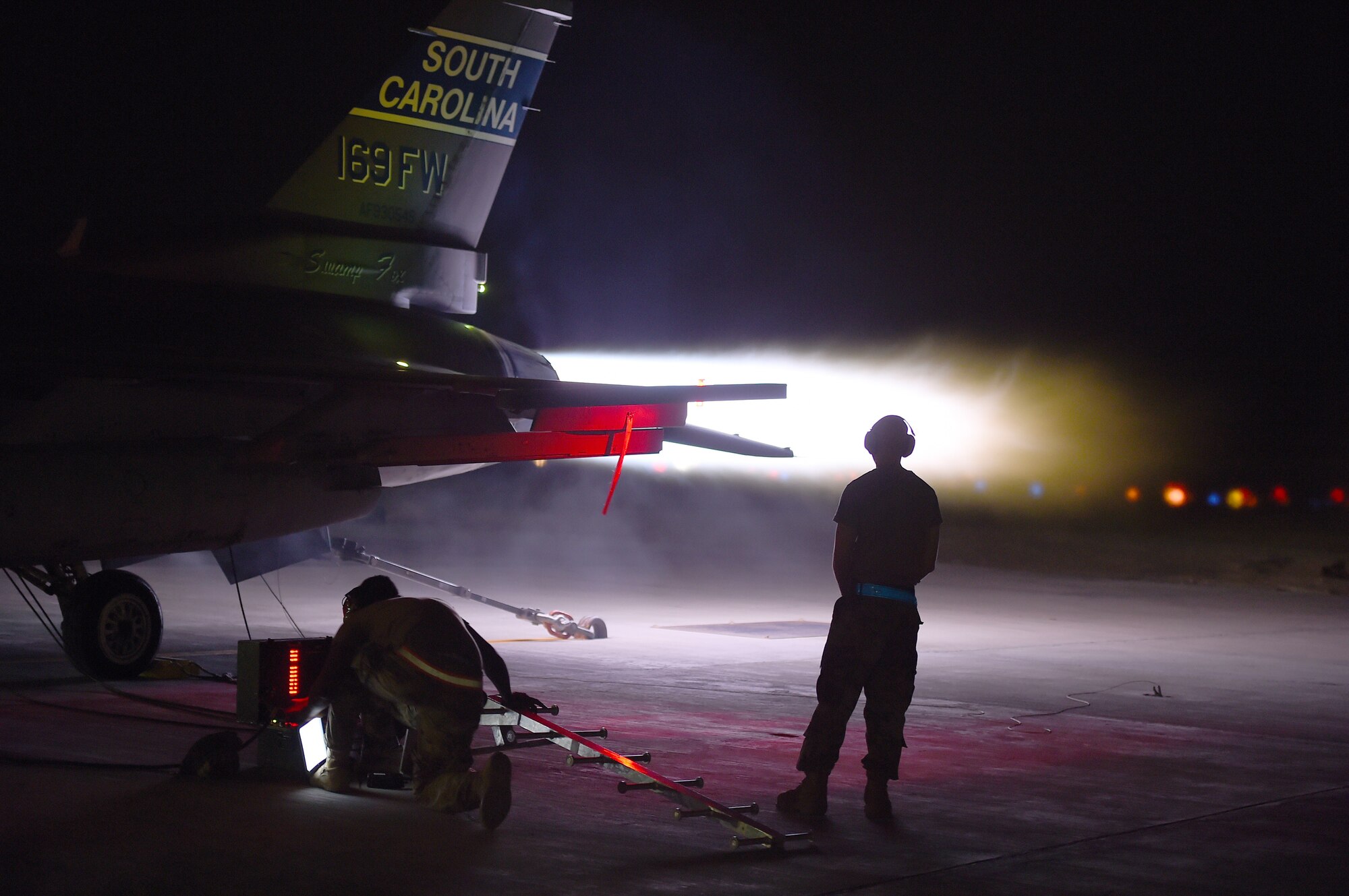 Maintenance members assigned to the 157th Expeditionary Fighter Squadron perform an afterburner run on an F-16 Fighting Falcon at an undisclosed location in Southwest Asia, Sept. 18, 2018. The F-16 is a compact, multi-role fighter aircraft. It is highly maneuverable, has proven itself in air-to-air combat and air-to-surface attack and can locate targets in all weather conditions and detect low flying aircraft in radar ground clutter. (U.S. Air Force photo by Staff Sgt. Dana J. Cable)