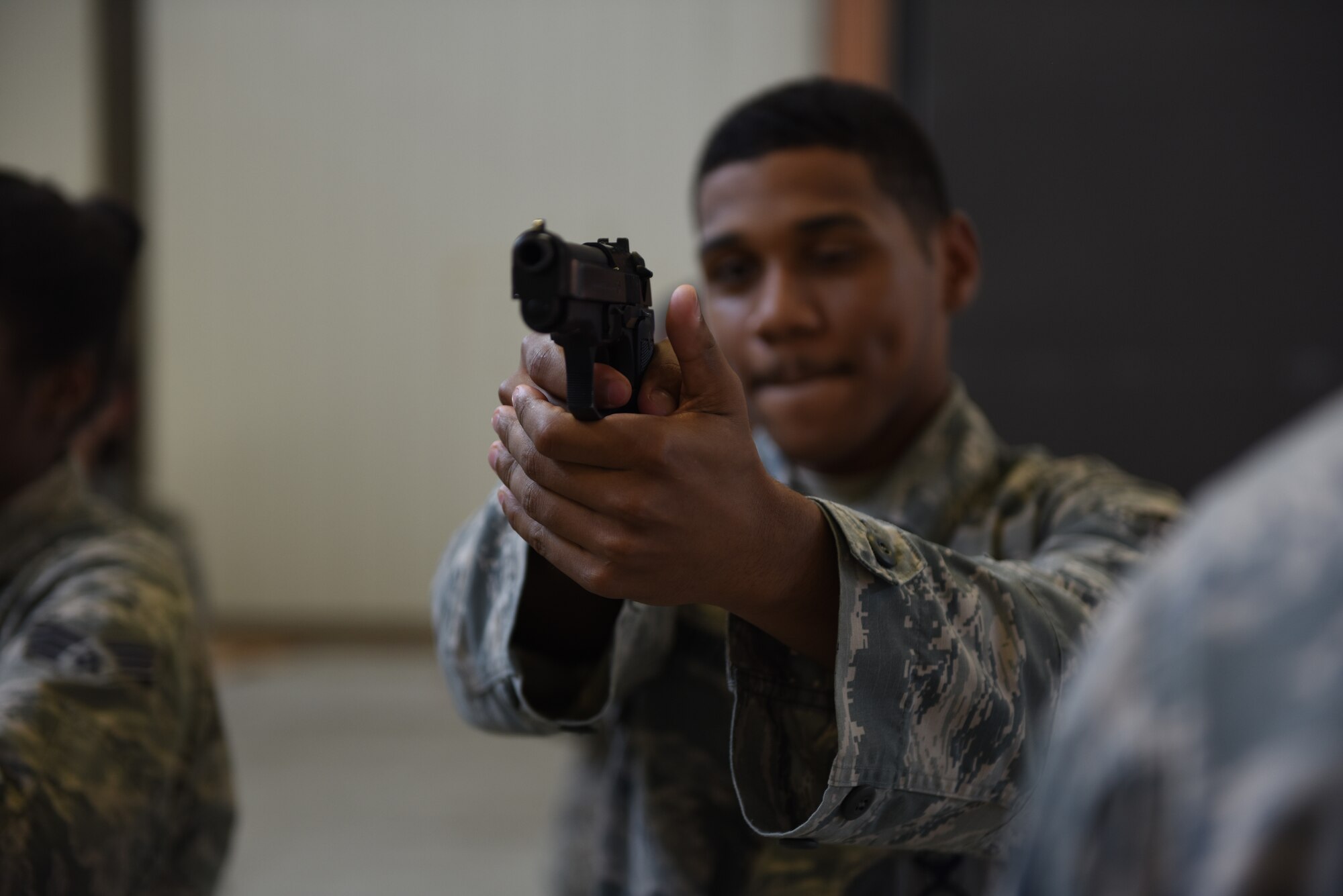 Airman 1st Class Jeremiah Renvill, 14th Security Forces Squadron installation entry controller, aims an unloaded M9 pistol after doing a weapon function check during an Operational Readiness Exercise: Ability to Survive and Operate course Sept. 19, 2018, on Columbus Air Force Base, Mississippi. The weapons familiarization portion of ATSO is to help Airmen get comfortable with using a weapon and also teaches them what to do if it misfires. (U.S. Air Force photo by Airman 1st Class Beaux Hebert)