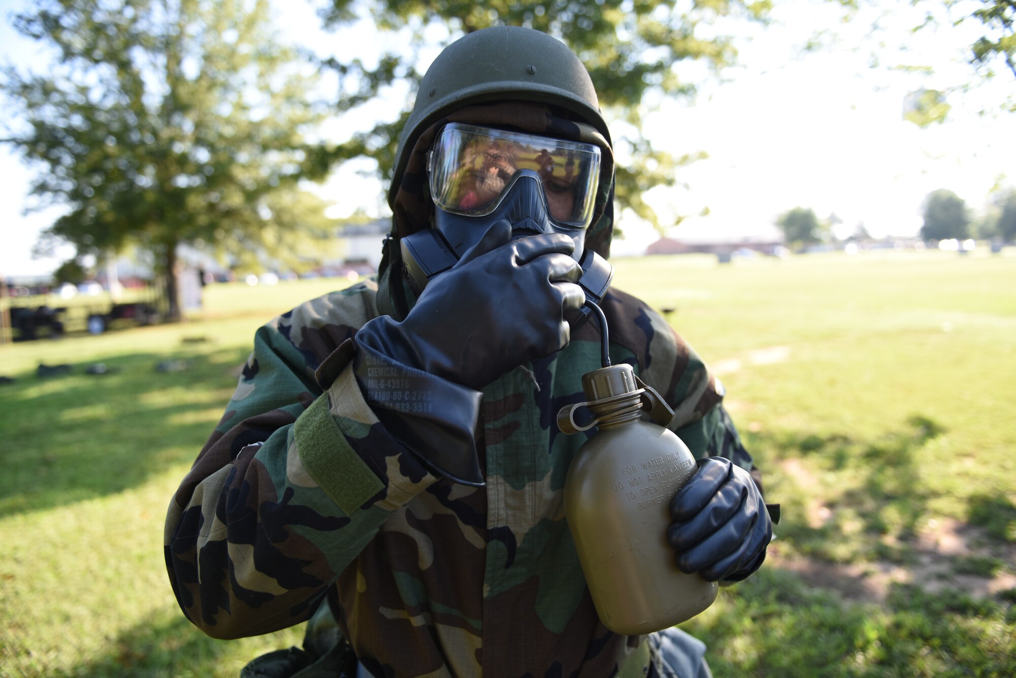 An Airman assigned to the 14th Flying Training Wing learns how to hydrate while using the M50 Joint Service General Purpose Mask during an Operational Readiness Exercise: Ability to Survive and Operate course Sept. 19, 2018, on Columbus Air Force Base, Mississippi. Airmen must stay hydrated while in Mission Oriented Protective Posture gear, but must not compromise the seal of their gas mask. The M50 has a drinking tube attached that allows Airmen to safely hydrate without risking contamination. (U.S. Air Force photo by Airman 1st Class Beaux Hebert)