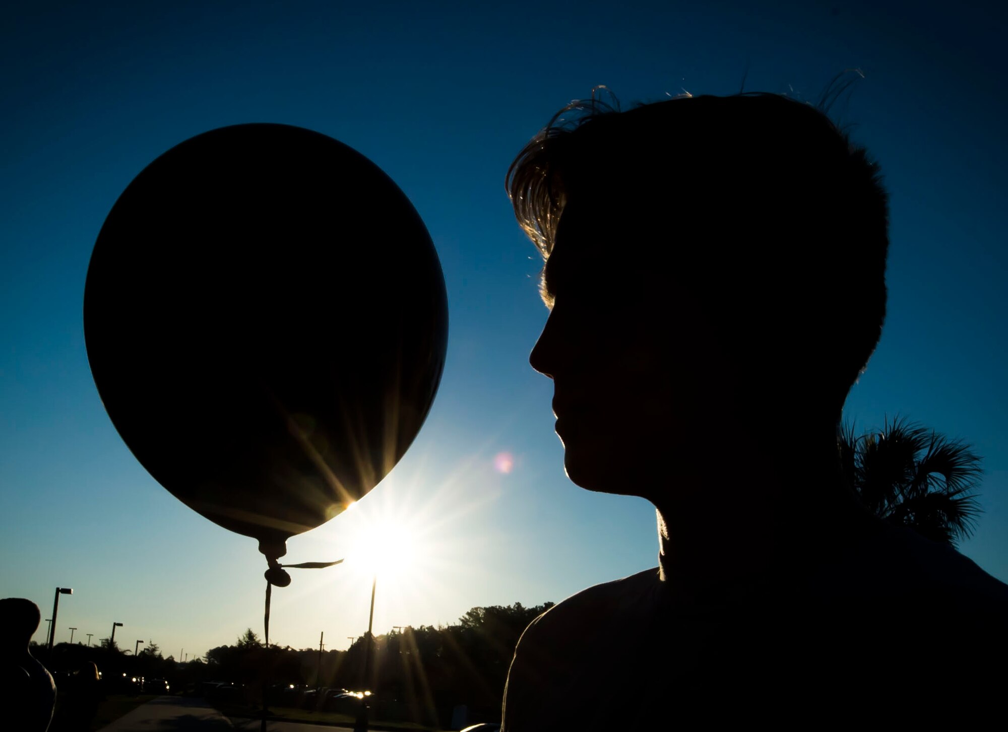 U.S. Air Force Staff Sgt. Zade Vadnais, 20th Fighter Wing Public Affairs community relations noncommissioned officer in charge, takes a moment to reflect during a POW/MIA balloon release ceremony at Shaw Air Force Base, S.C., Sept. 19, 2018.
