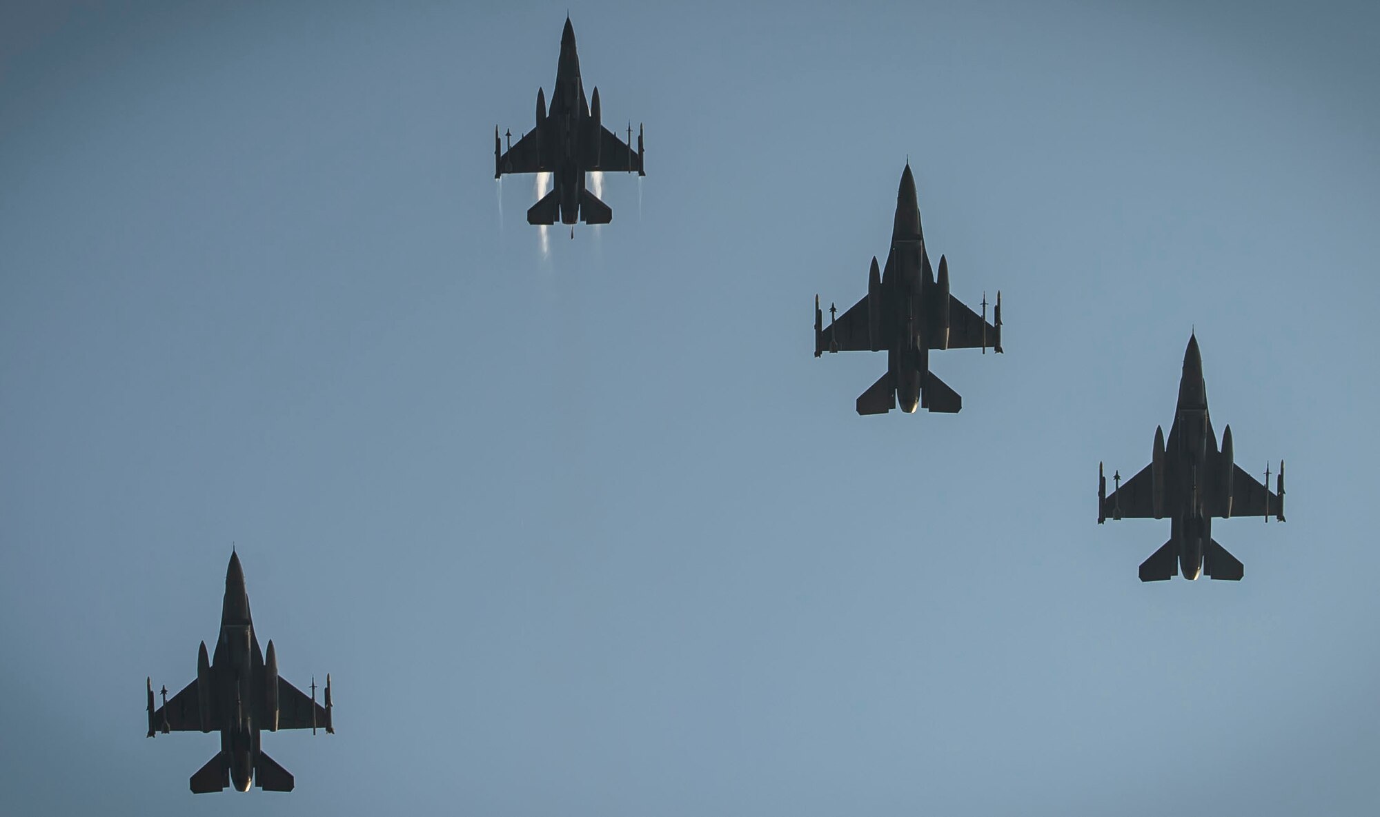 U.S. Air Force F-16CM Fighting Falcon pilots perform a missing man formation fly over during a POW/MIA ceremony at Shaw Air Force Base, S.C., Sept. 21, 2018.