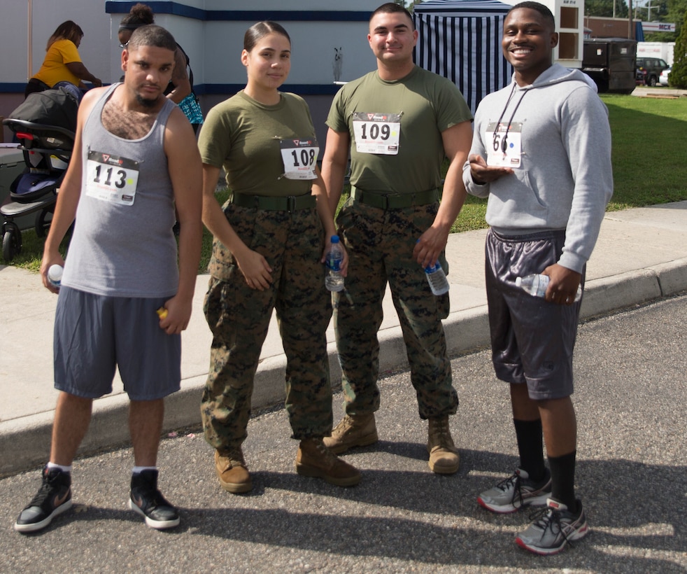 Marines from U.S. Marine Corps Forces Command prepare for  the Marine Corps Community Services 2018 Resource and Health Fair Run/Walk 5K near Naval Support Activity Hampton Roads, Sept. 21. Participants enjoyed food, music, and prizes during the event. Official U.S. Marine Corps photo by Chris Jones/Released)