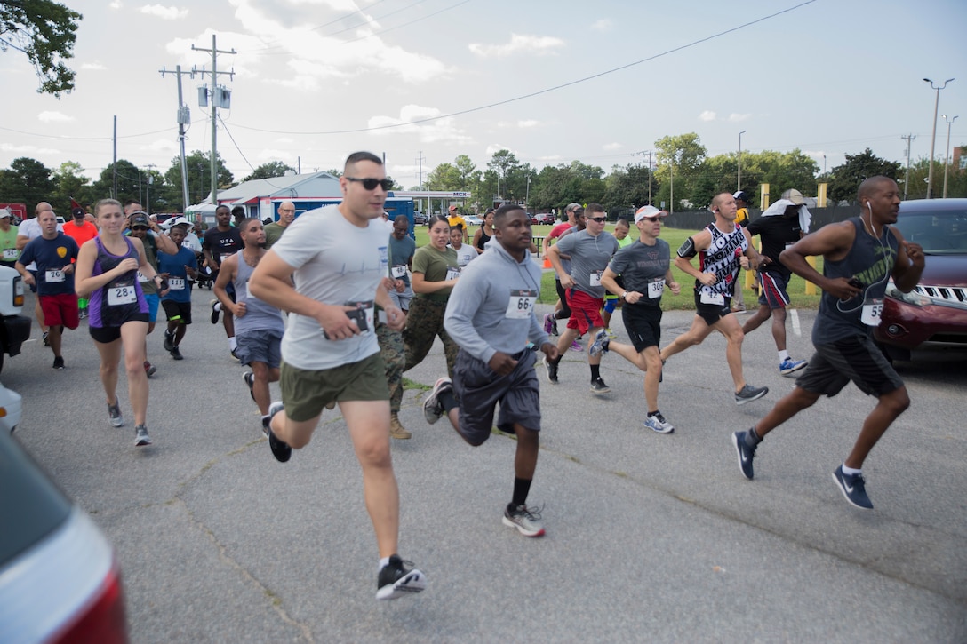 Service member and their families from the Hampton Roads, Va. area participate in the Marine Corps Community Services 2018 Resource and Health Fair Run/Walk 5K near Naval Support Activity Hampton Roads, Sept. 21. Participants enjoyed food, music, and prizes during the event. Official U.S. Marine Corps photo by Chris Jones/Released)