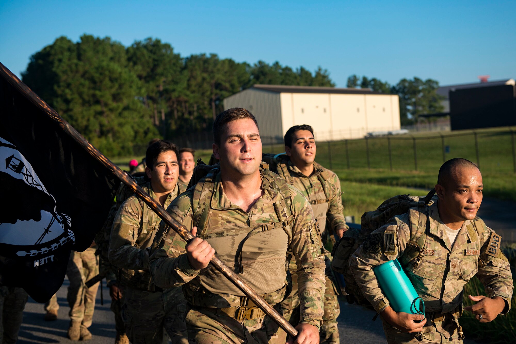 Airmen from the 822d Base Defense Squadron run during the POW/MIA Recognition Day ruck march, Sept. 21, 2018, at Moody Air Force Base, Ga. For the first-time, the 347th Operations Support Squadron hosted a ruck march to pay tribute to those who’ve been captured or missing in the line of duty by carrying a POW/MIA flag for 24 hours. (U.S. Air Force photo by Airman 1st Class Erick Requadt)