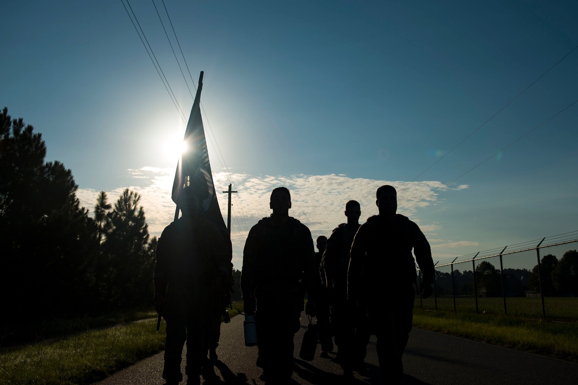 Airmen from the 822d Base Defense Squadron participate in the POW/MIA Recognition Day ruck march, Sept. 21, 2018, at Moody Air Force Base, Ga. For the first-time, the 347th Operations Support Squadron hosted a ruck march to pay tribute to those who’ve been captured or missing in the line of duty by carrying a POW/MIA flag for 24 hours. (U.S. Air Force photo by Airman 1st Class Erick Requadt)