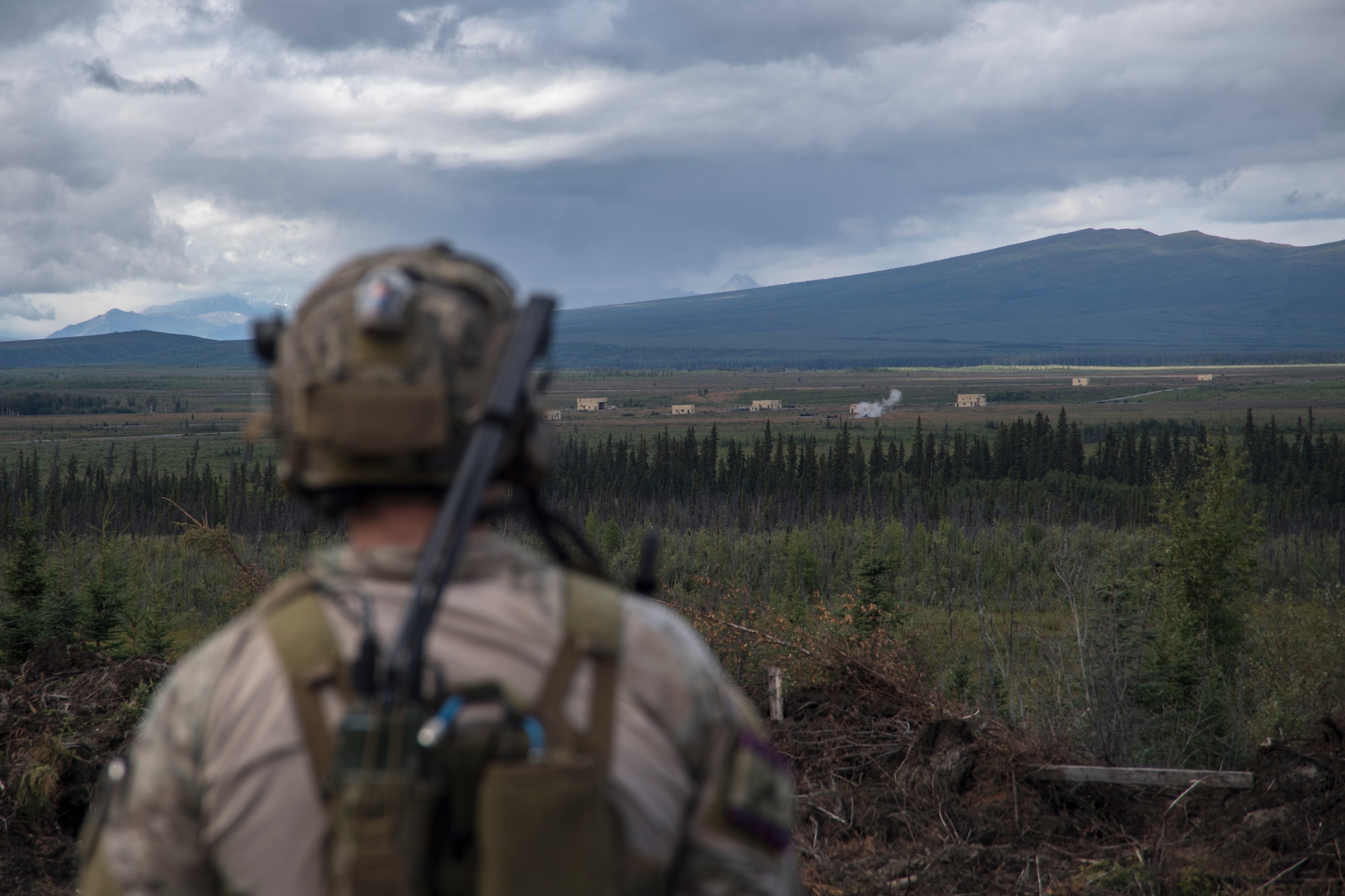 A Special Tactics Airman with the 17th Special Tactics Squadron surveys a target following close air support training during RED FLAG-Alaska 18-3 at Eielson Air Force Base, Alaska, Aug. 16, 2018.