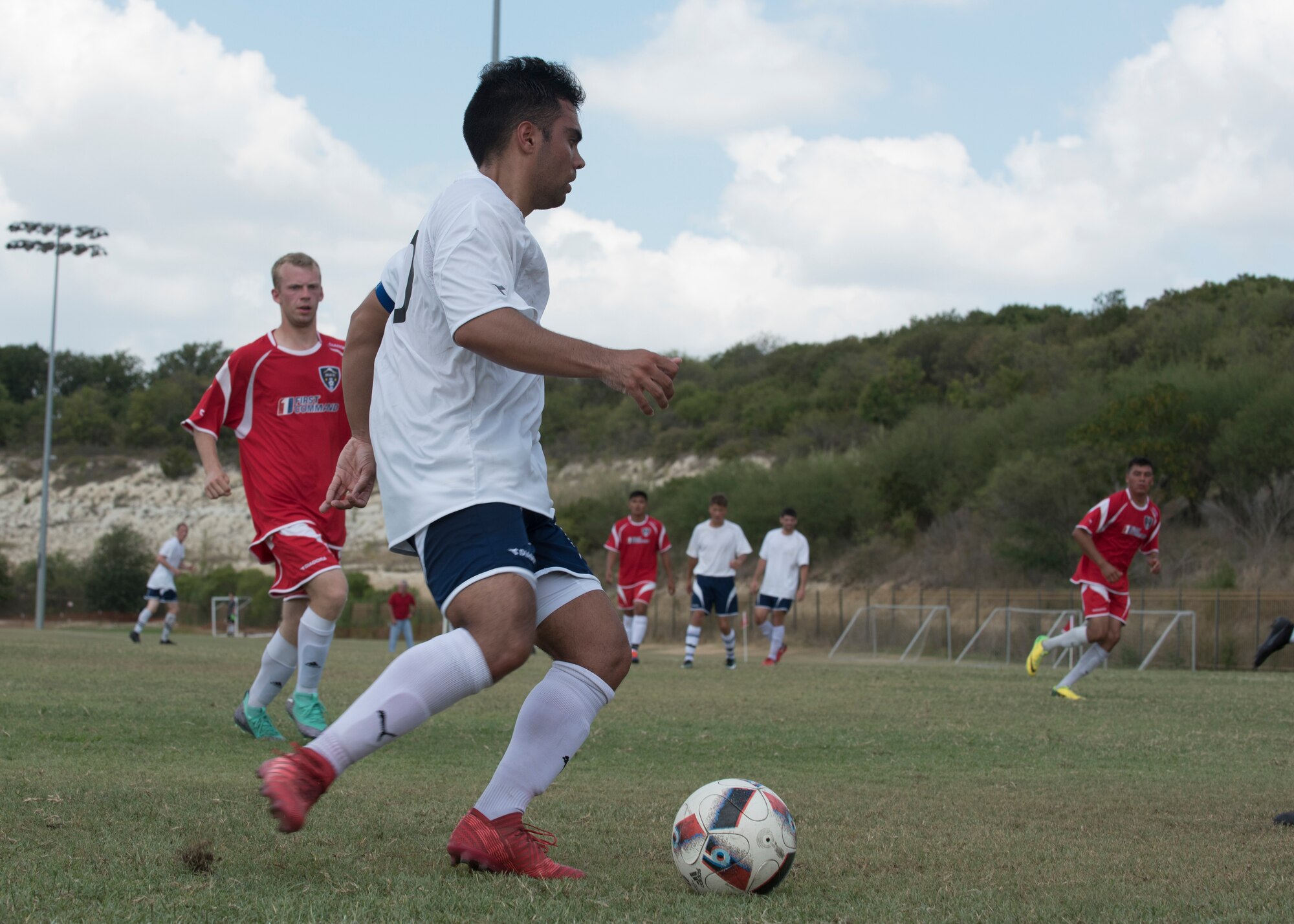 Staff Sgt. Joseph Haug, Holloman's Varsity Soccer Team captain, dribbles the ball Sept. 2, at the South Texas Area Regional Soccer Complex in San Antonio, Texas, during the 2018 Defender's Cup. Haug formerly played for the Air Force Armed Forces Men's Soccer Team. (U.S. Air Force photo by Airman Autumn Vogt)