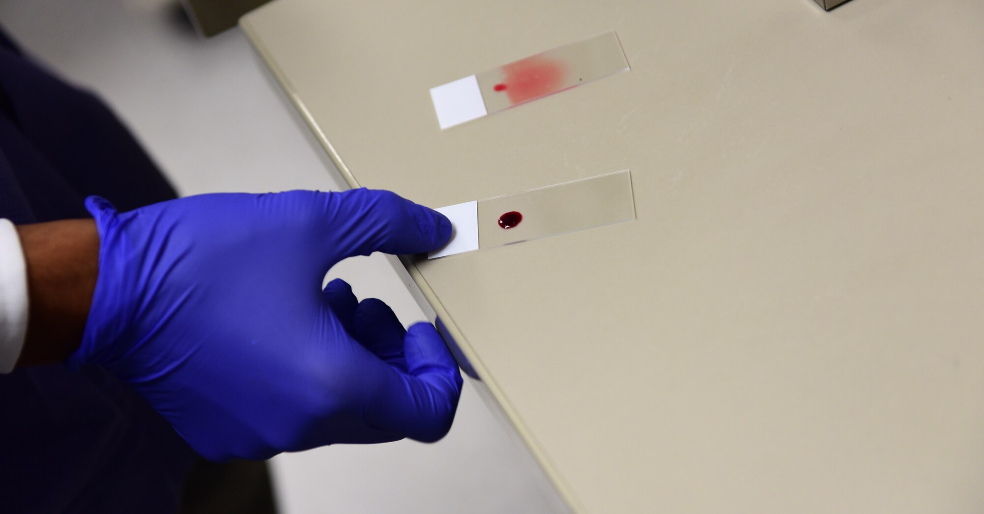 U.S. Air Force Staff Sgt. Jadow Hughes, 325th Medical Support Squadron laboratory technician, prepares a blood sample to be inspected during the Airman Shadow program at Tyndall Air Force Base, Fla., Sept. 5, 2018. Medical laboratory specialists conduct state-of-the-art analysis that not only helps prevent and treat disease, but is essential to detecting agents that indicate biological warfare. (U.S. Air Force photo by Senior Airman Cody R. Miller)