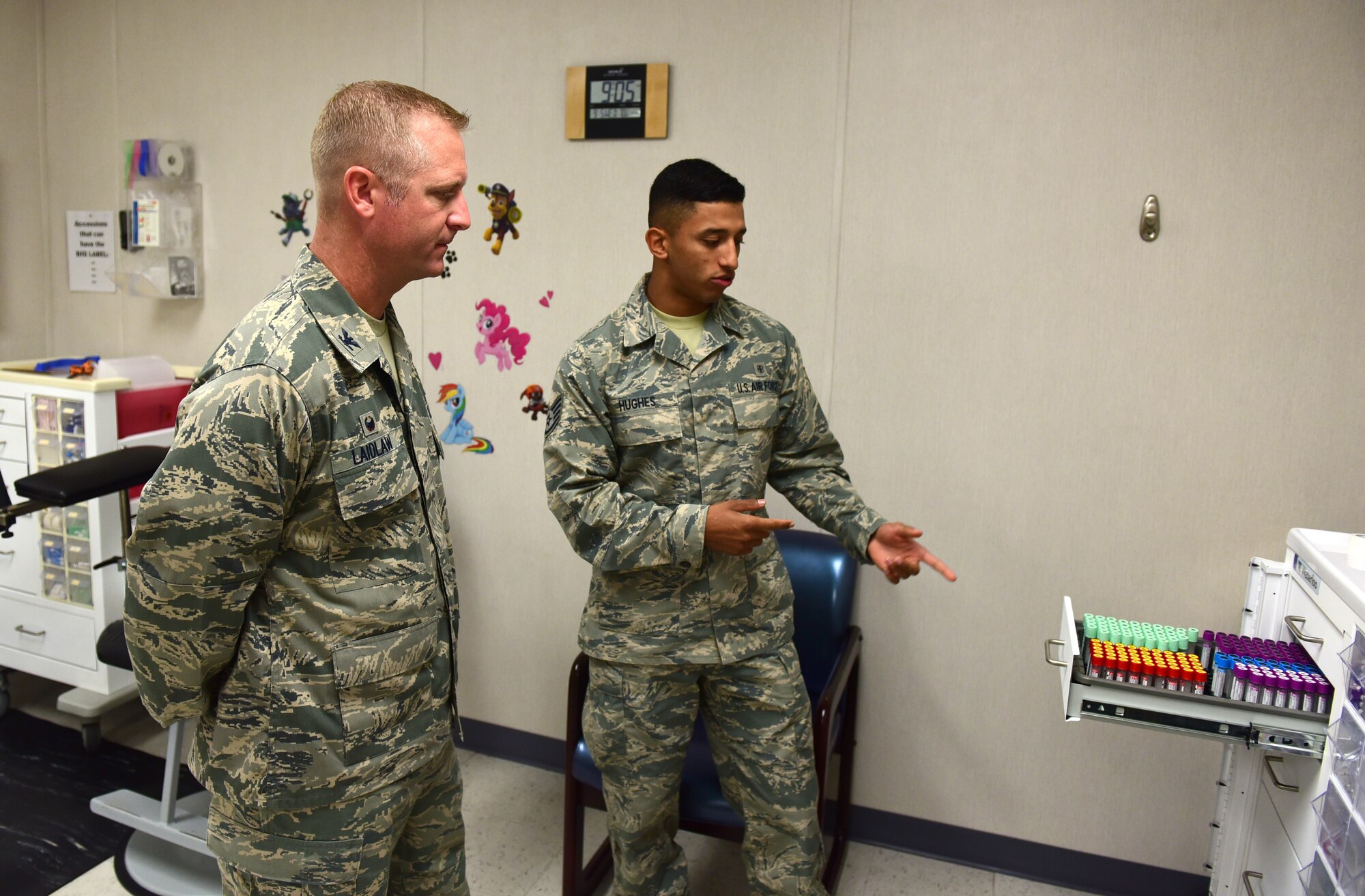 U.S. Air Force Staff Sgt. Jadow Hughes, 325th Medical Support Squadron laboratory technician, shows Col. Brian Laidlaw, 325th Fighter Wing commander, how vials of blood are stored after they are drawn from patients at Tyndall Air Force Base, Fla., Sept. 5, 2018. Helping conduct essential tests on body substances, medical laboratory specialists have an integral role in providing patients with a proper diagnosis and treatment. (U.S. Air Force photo by Senior Airman Cody R. Miller)