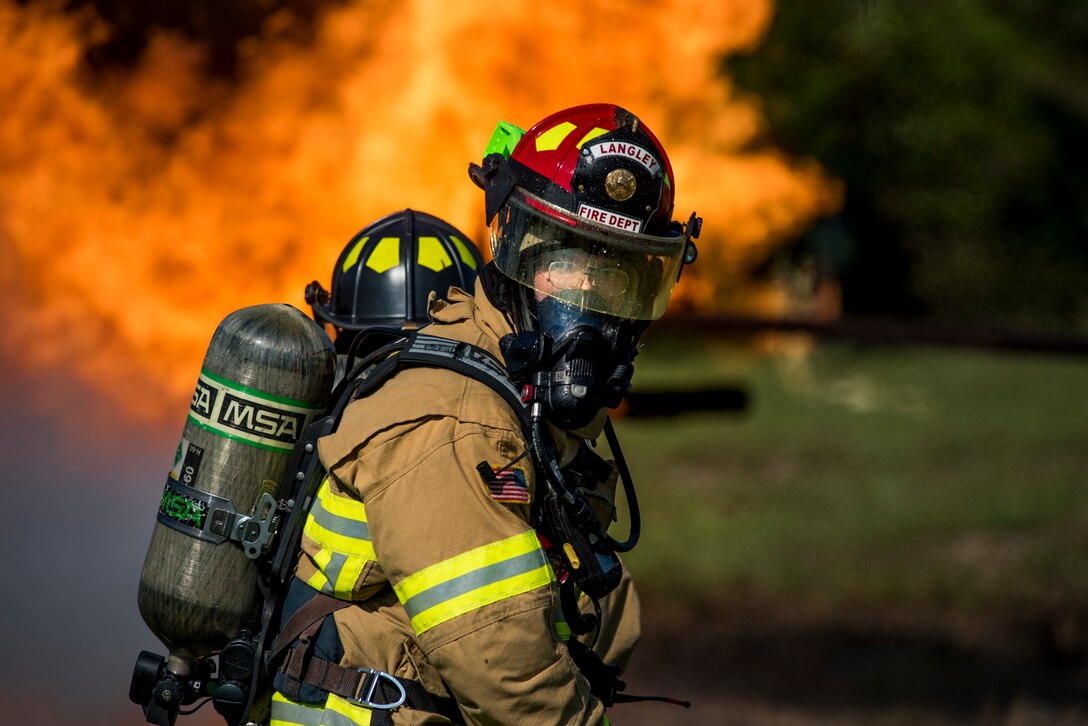 U.S. Air Force Staff Sgt. Isaac Sunnock, 633rd Civil Engineer Squadron lead firefighter, participates in a live-fire training exercise at Joint Base Langley-Eustis, Virginia, Sept. 19, 2018.