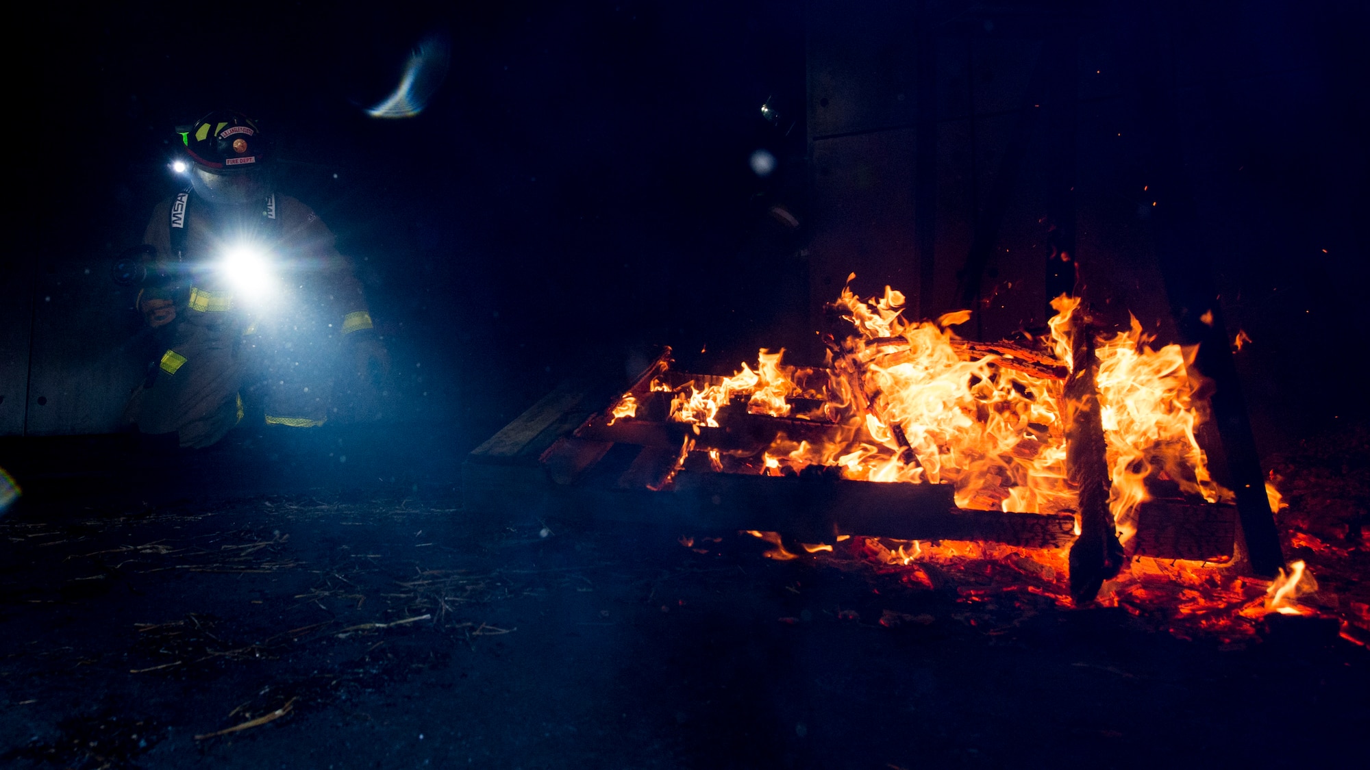 A U.S. Air Force Airman assigned to the 633rd Civil Engineer Squadron participates in a fire training exercise at Joint Base Langley-Eustis, Virginia, Sept. 20, 2018.
