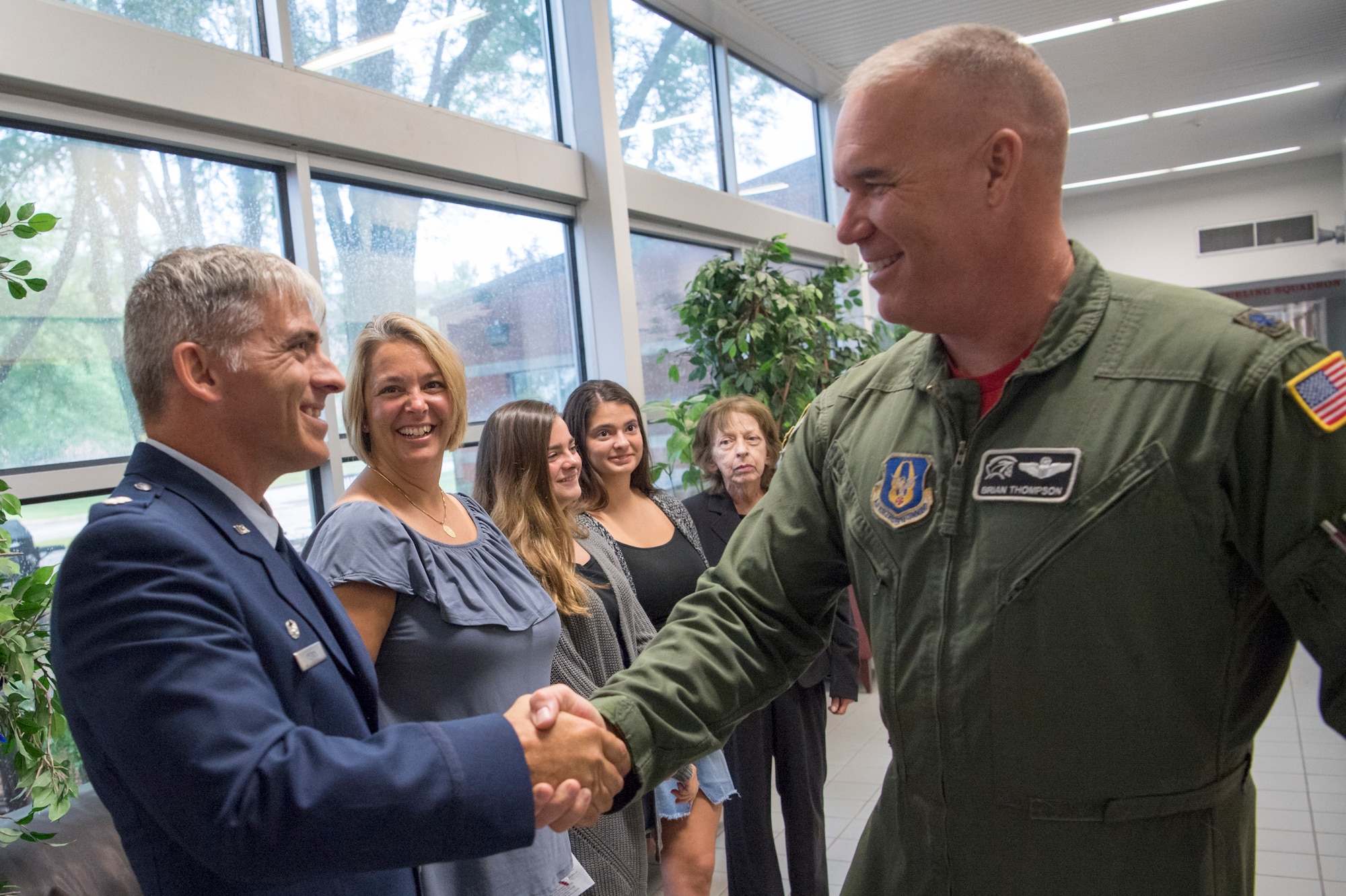 Lt. Col. Douglas Perry, 434th Operations Support Squadron commander, left, shakes hands with Lt. Col. Brian Thompson, 434th Operations Group chief of standardization an evaluation, following an assumption of command ceremony at Grissom Air Reserve Base, Ind., Sept. 8, 2018.  The main mission of the 434th OSS is to support the 434th Air Refueling Wing combat-ready KC-135 Stratotanker aircrews. (U.S. Air Force photo by Tech. Sgt. Ben Mota)