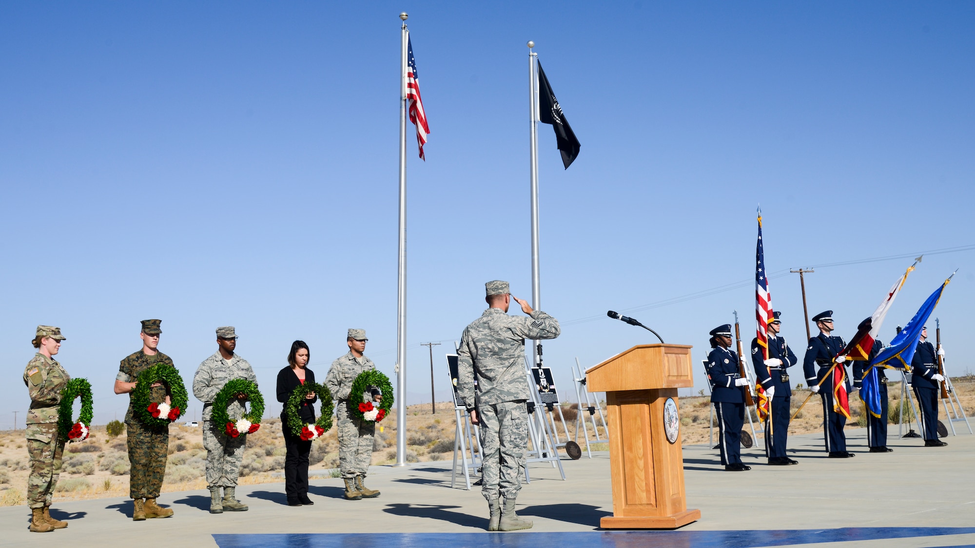 Edwards personnel render honors to the Nation’s flag during a wreath-laying ceremony commemorating National POW/MIA Recognition Day at the Airman Leadership School Drill Pad at Edwards Air Force Base, California, Sept. 21. (U.S. Air Force photo by Giancarlo Casem)