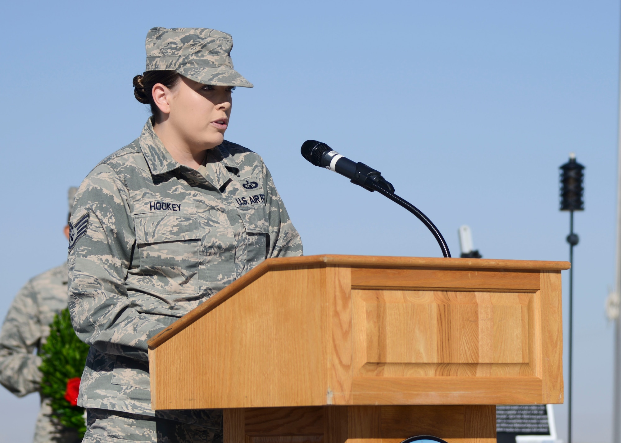 Staff Sgt. Ashley Hookey, 412th Operations Suport Squadron, recounts the story of the sinking of the Japanese “Hell Ship” Junyo Maru at a wreath-laying ceremony commemorating National POW/MIA Recognition Day at the Airman Leadership School Drill Pad at Edwards Air Force Base, California, Sept. 21. The unmarked Junyo Maru was transporting prisoners of war when it was sunk of the coast of Sumatra on Sept. 18, 1944. Hookey’s great-grandfather was one of those killed during the sinking. (U.S. Air Force photo by Giancarlo Casem)