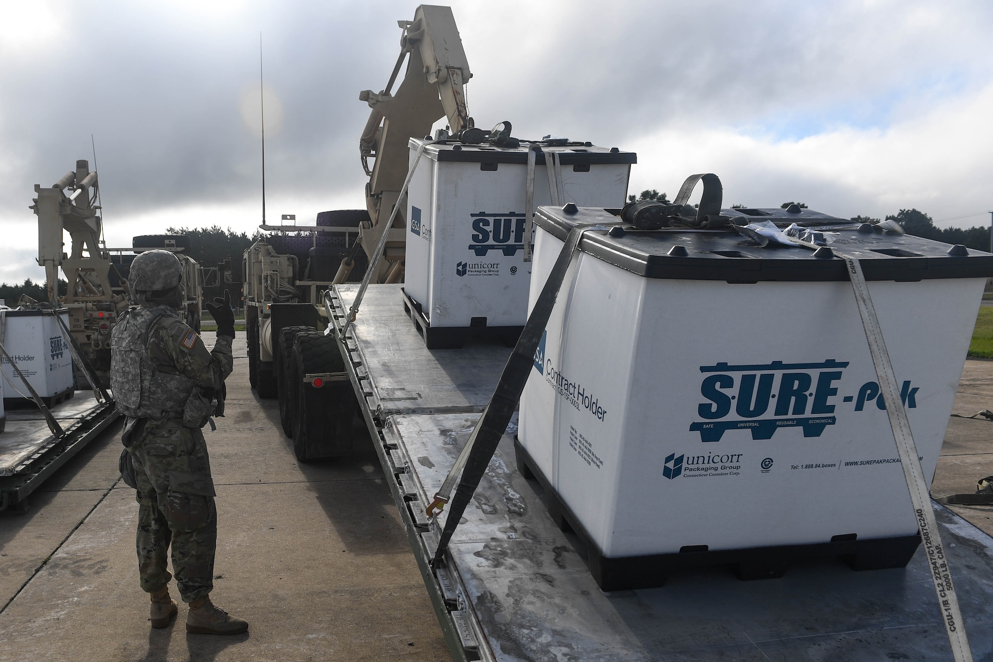 A U.S. Army Soldier guides cargo onto a truck during Exercise Turbo Distribution 18-02 at Fort McCoy, Wisconsin, Sept. 9, 2018. The exercise consisted of 24-hour operations that constantly had cargo shipments arrive from a C-130J Super Hercules and other simulated aircraft. (U.S. Air Force photo by Senior Airman Derek Seifert)